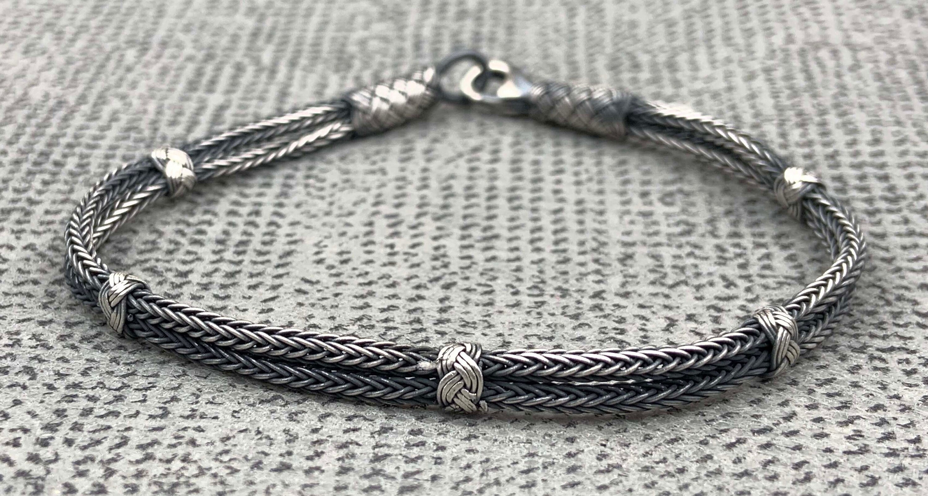 Make sure your man doesn't go unnoticed this Father's Day with this stylish and unique layered bracelet! He'll love the attention to detail that went into crafting it, from the sterling silver clasp to the woven layers.