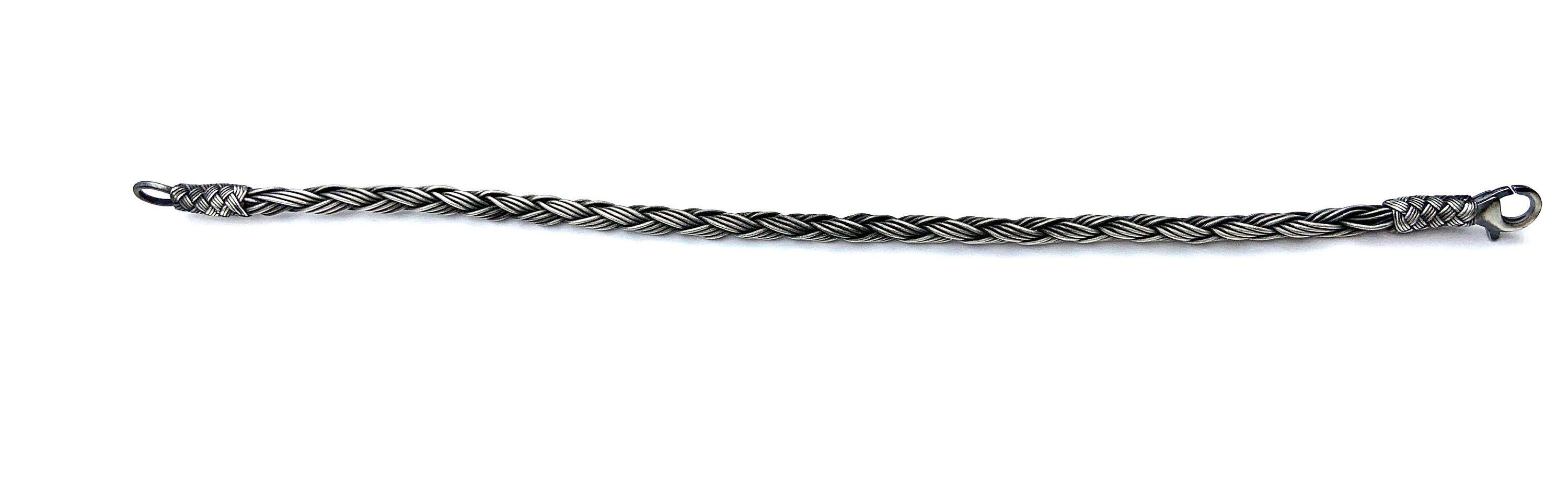 Dazzle your friends and family with a delicate, layered Men's Bracelet made from sterling silver beads and delicate Macrame strands. This classy gift is perfect for anyone on your list!