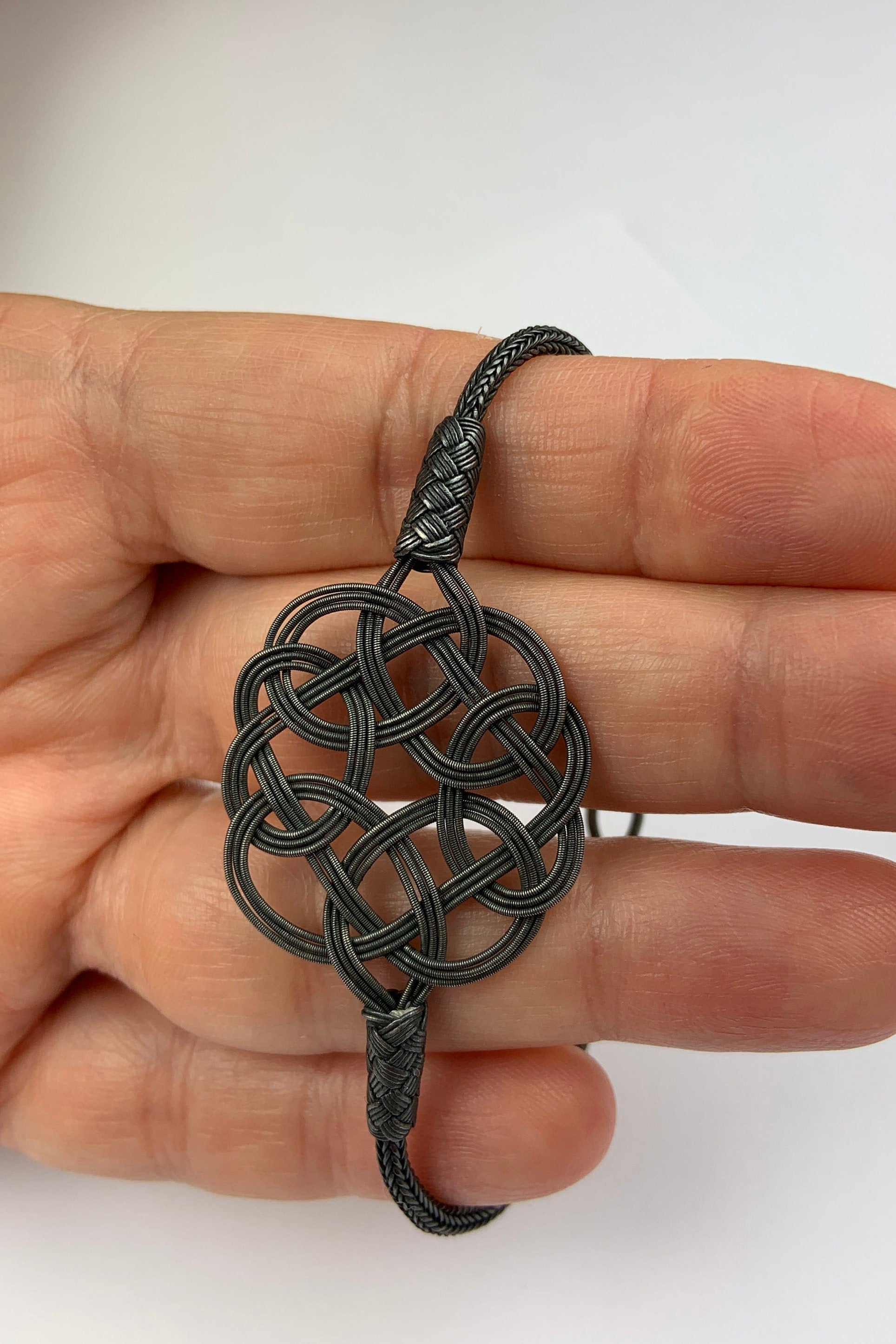 Midnight Mystique: Black Sterling Silver Braided Knot Bracelet