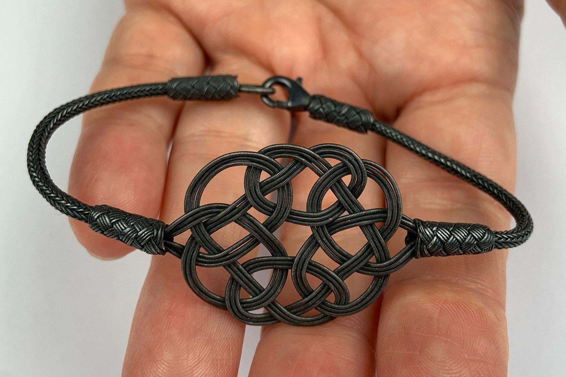 Midnight Mystique: Black Sterling Silver Braided Knot Bracelet