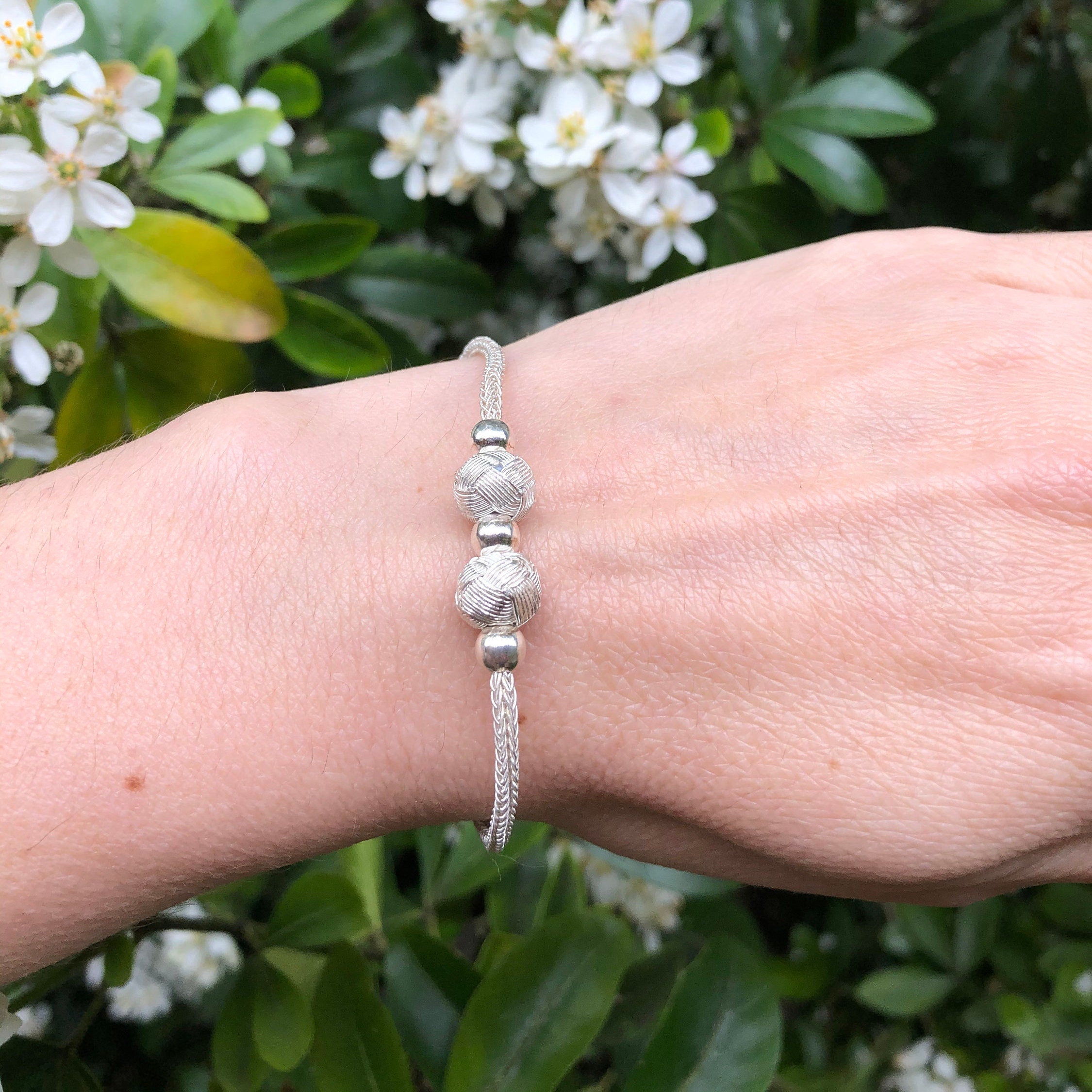 Make this Mothers Day a special one by giving her a unique, handmade silver wire bracelet from Trabzon Bracelet. This unique band is made with thin silver wire and features a beautiful design band.