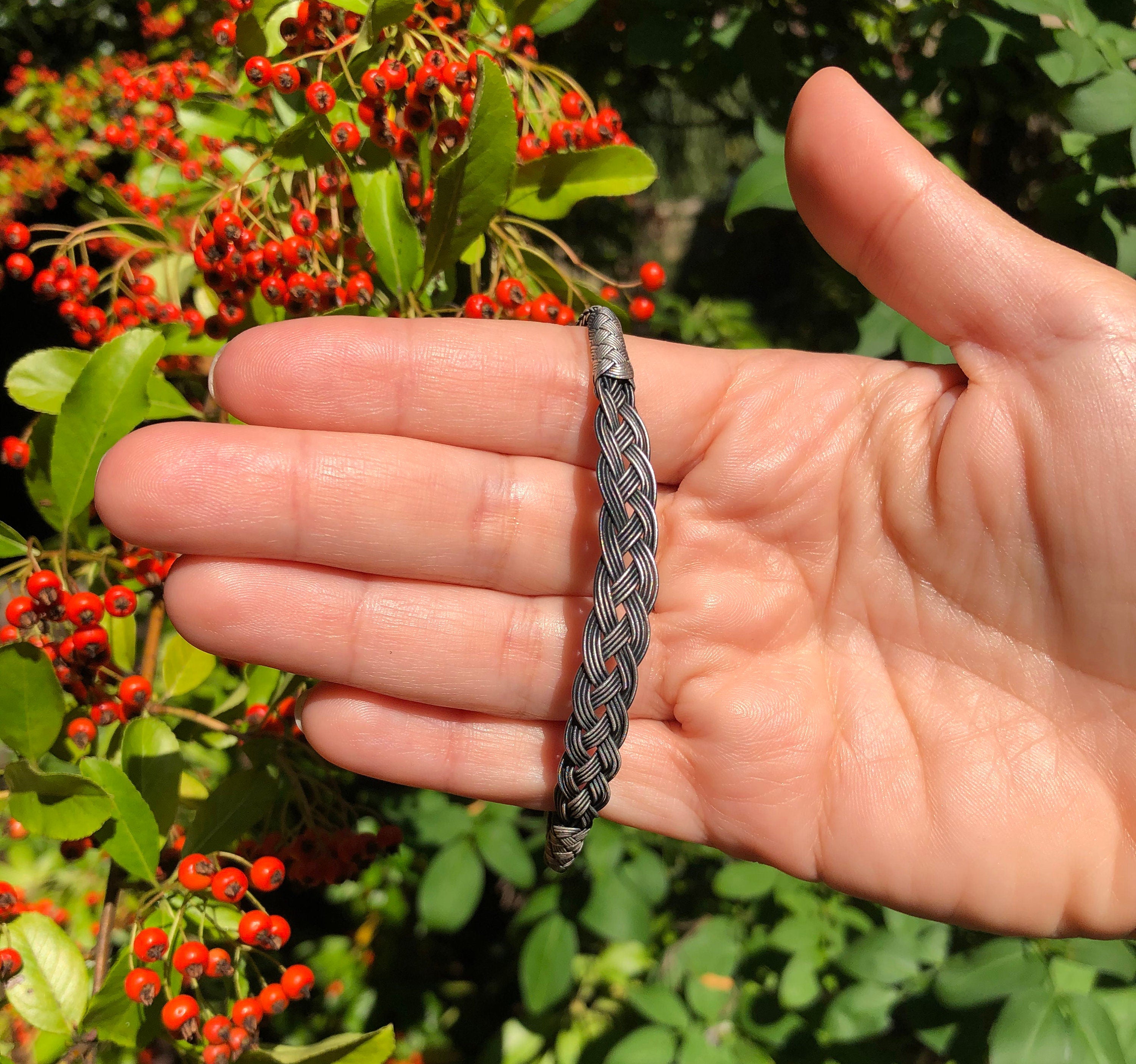 Make mom's day with this beautiful, handmade silver bracelet! It is made of multiple layers of sterling silver, and it comes with a delicate, sterling silver chain.