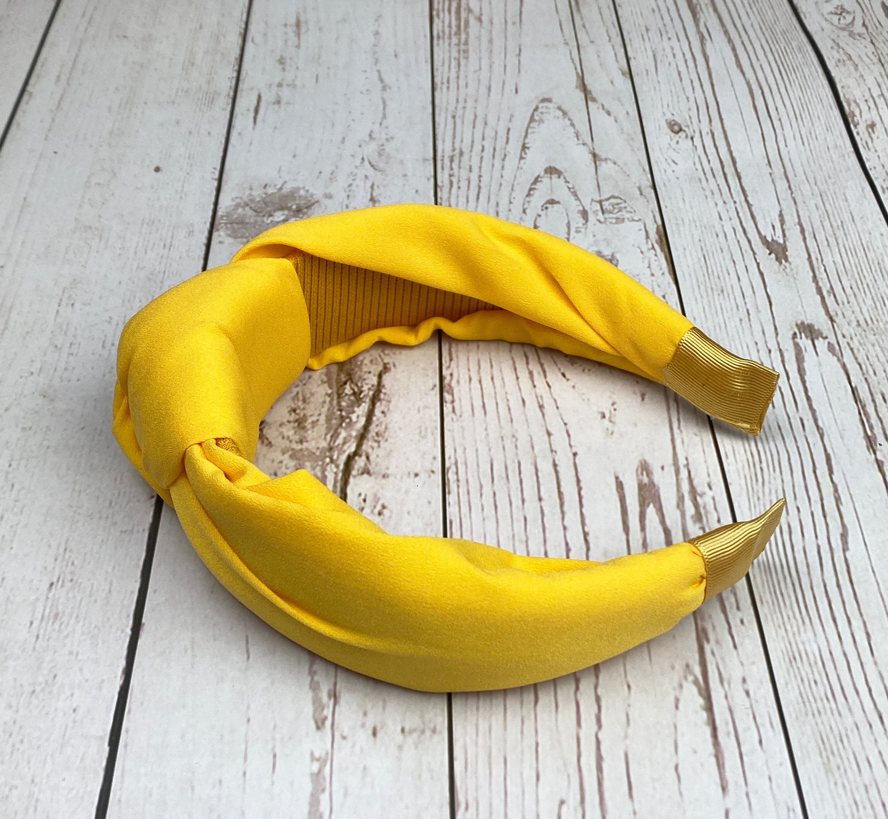 Need a hair accessory that's both fashionable and functional? Our Wide Headband is a perfect choice! With its comfortable fit and versatile design, it's great for keeping your hair out of your face while looking chic.