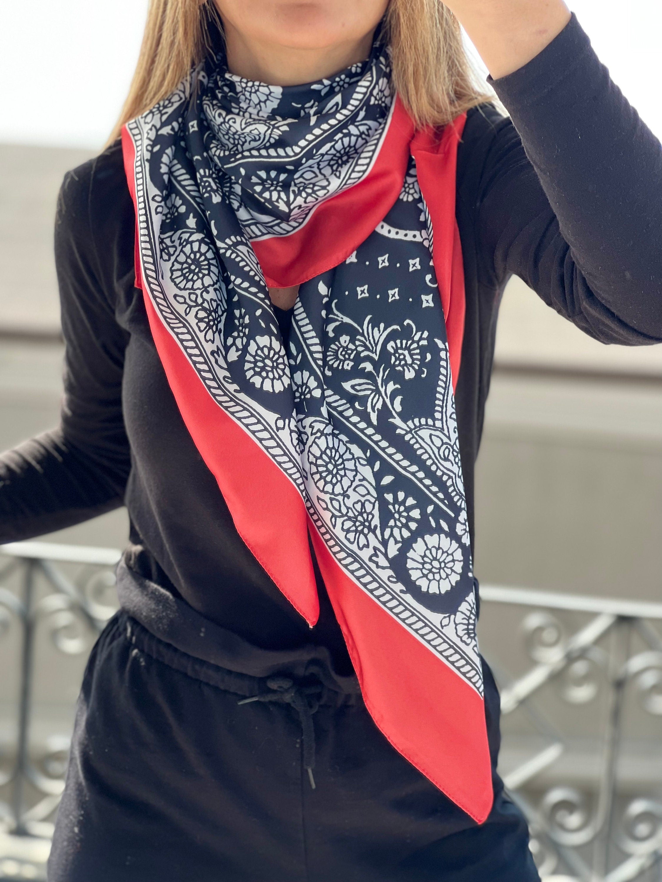 A beautiful Design Neck Scarf in a classic Red, Black, and White color scheme, making it easy to pair with any outfit.