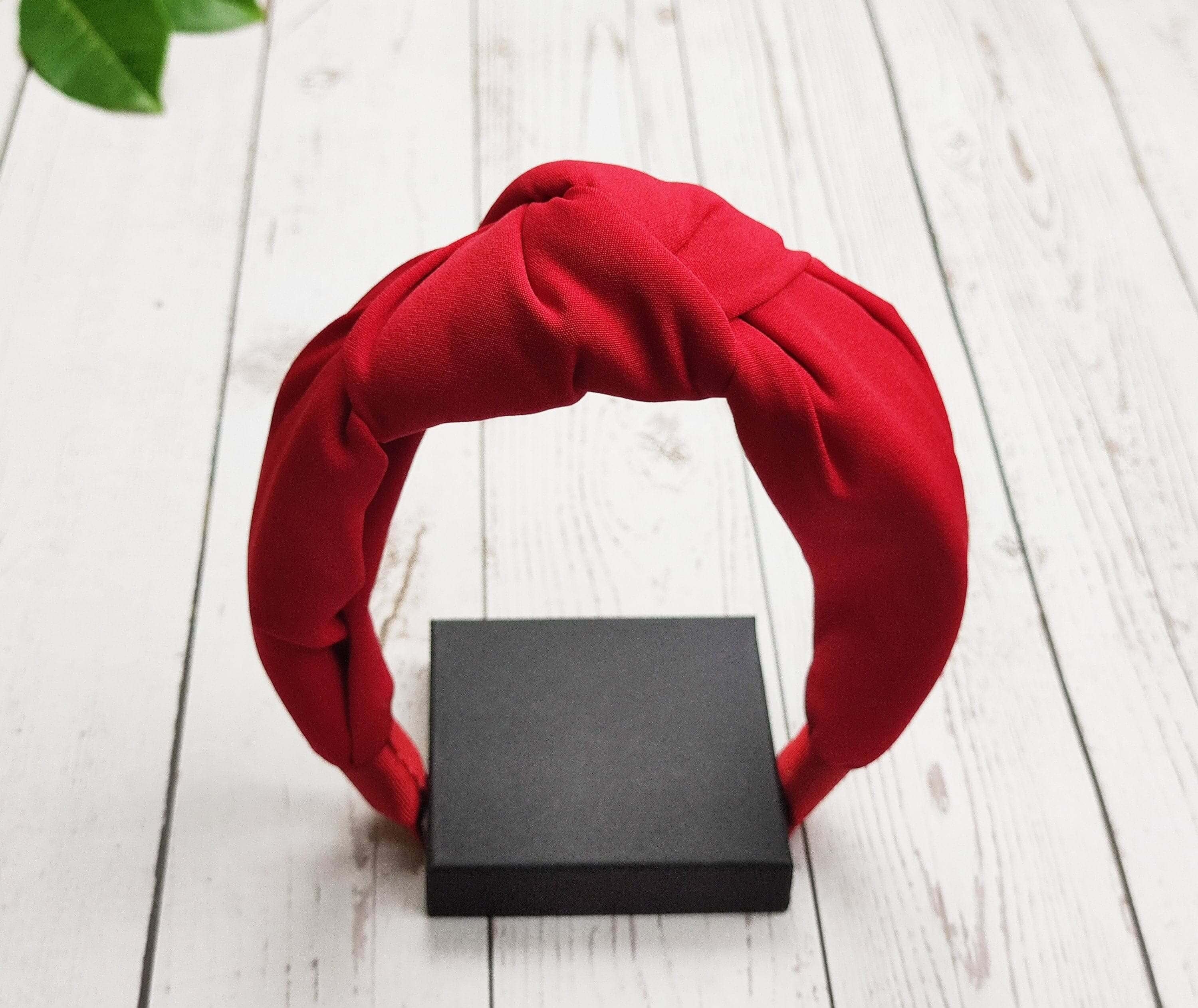Check out our collection of fashionable hair accessories today, including our popular tie headband! This versatile accessory can be worn as a hair band, headband, or even scarf-style!