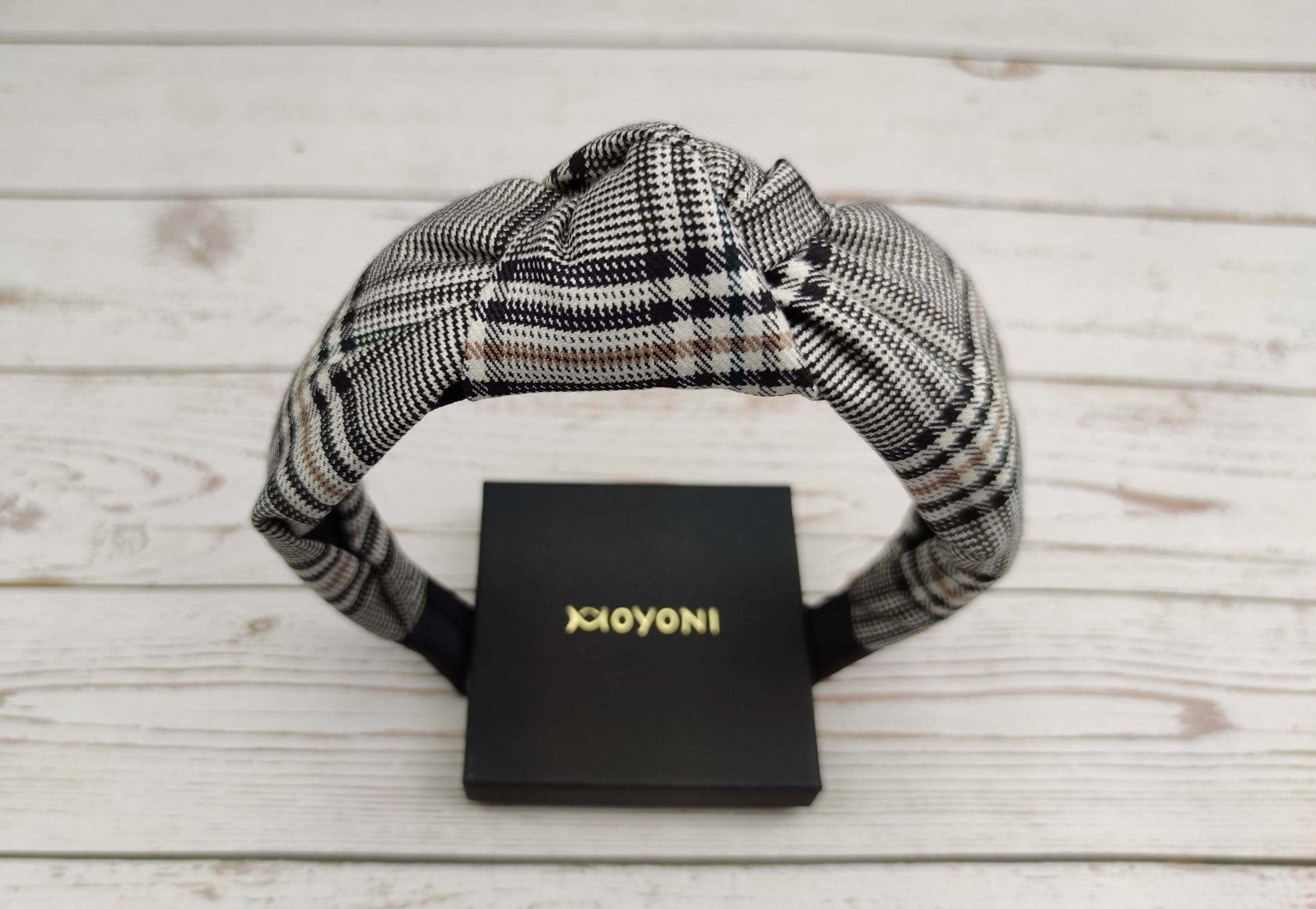 Stylish Striped Knotted Headband: Elevate your college girl look with this chic crepe headband in white and black stripes. Versatile and trendy for any occasion.