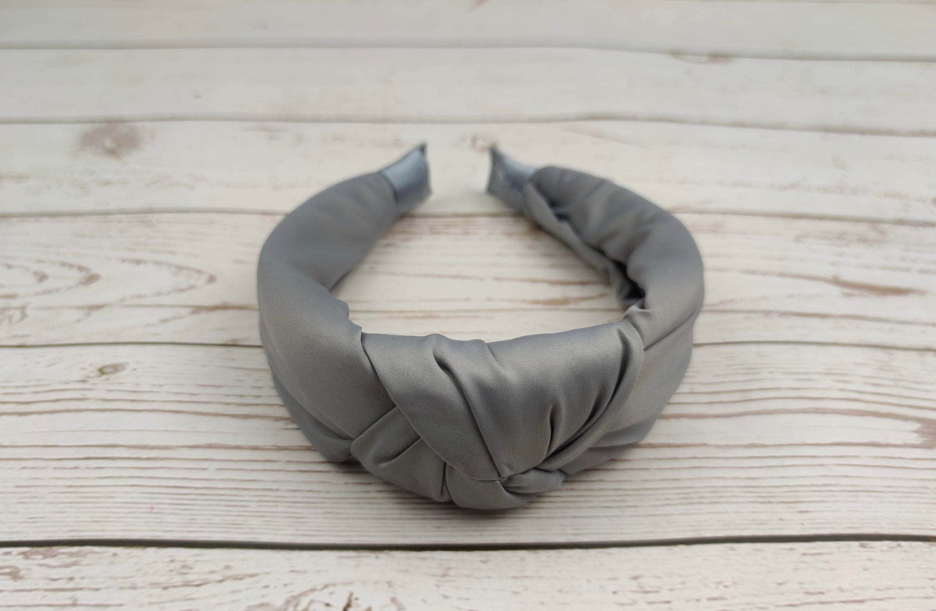 Add some personality to your look with a personalized light gray knotted headband! We make them in a variety of colors and styles to suit your every need.