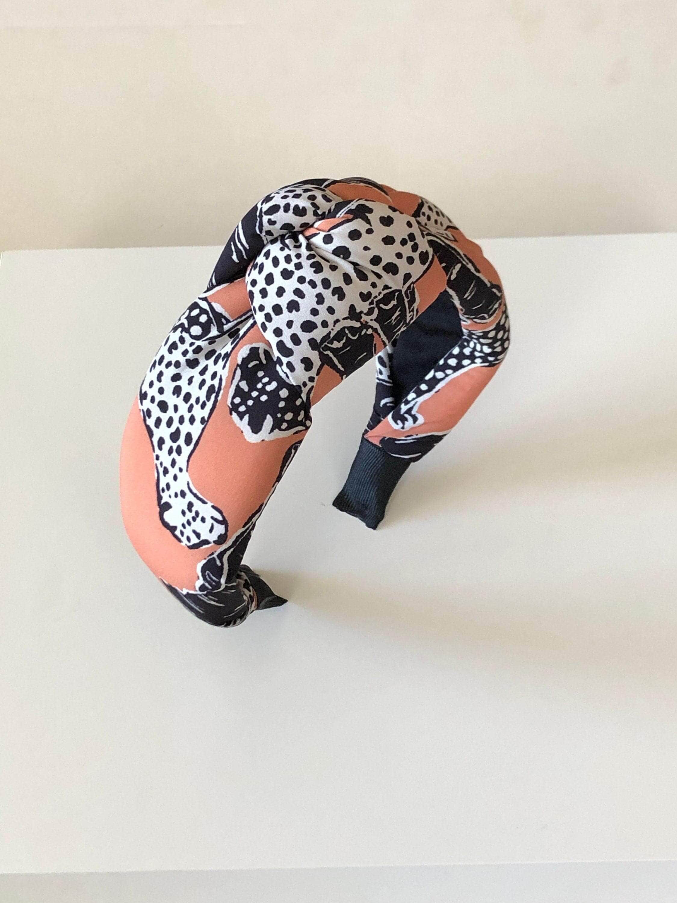 Elevate your fashion game with this on-trend Light Pink Black White Color Headband