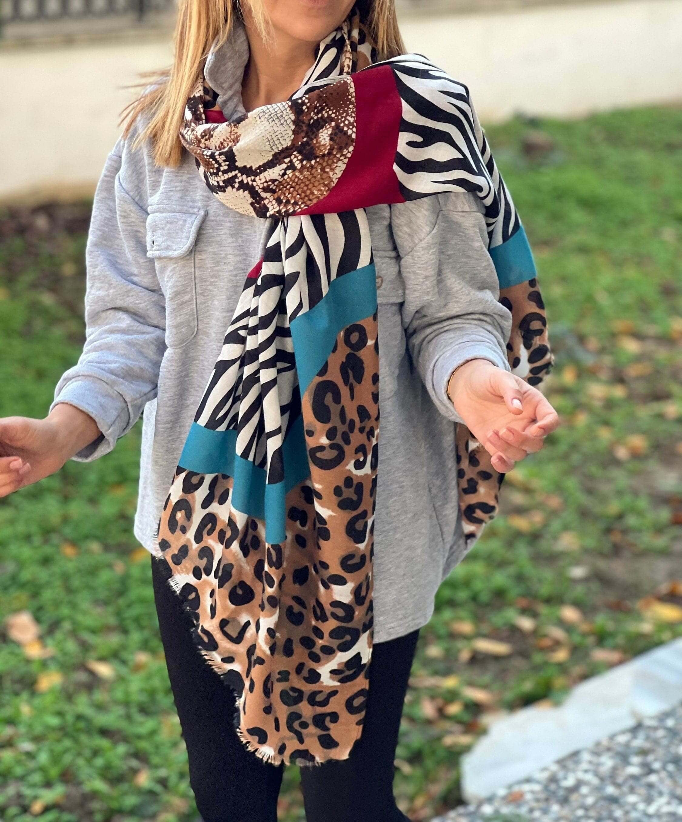 Made from soft, high-quality cotton, this scarf is as comfortable as it is stylish. And with its softly frayed edges, it adds a touch of rustic charm to any outfit.