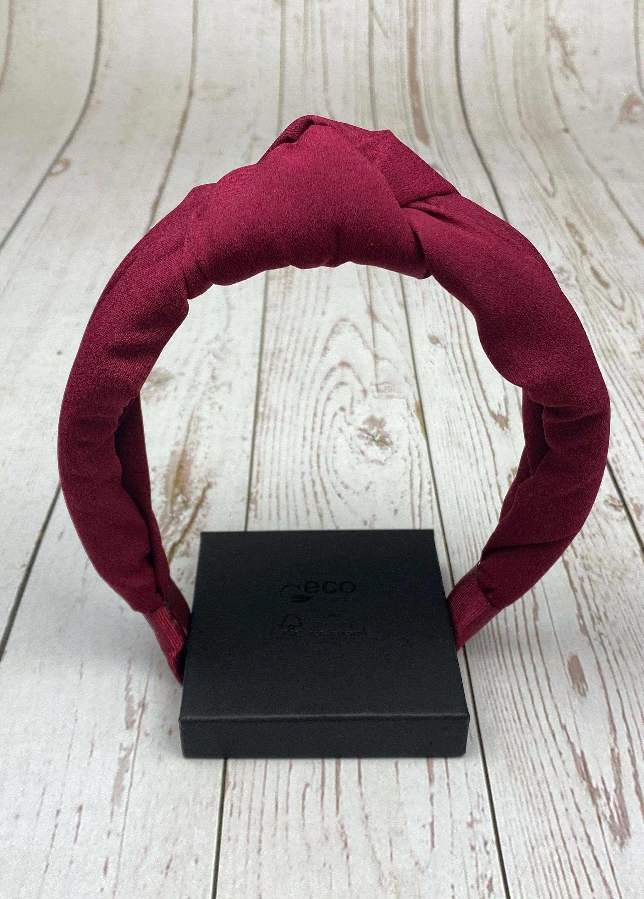 If you're in the mood for something more festive, try out a wine-color elegant hairband made from beautiful and luxurious fabric.