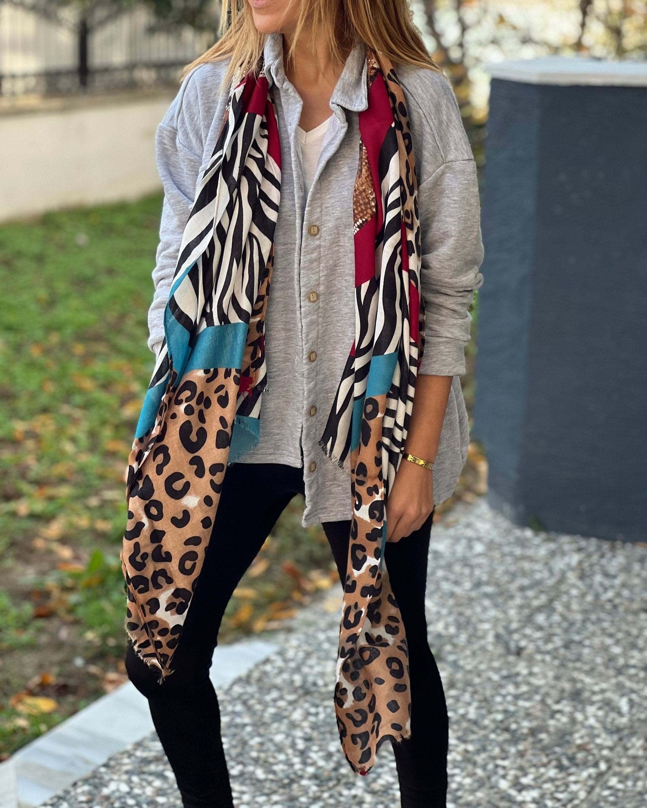 Bring the wildness of the animal kingdom into your wardrobe with our range of leopard, zebra, and snake skin scarves! These stylish pieces are perfect for adding some spice to your life.