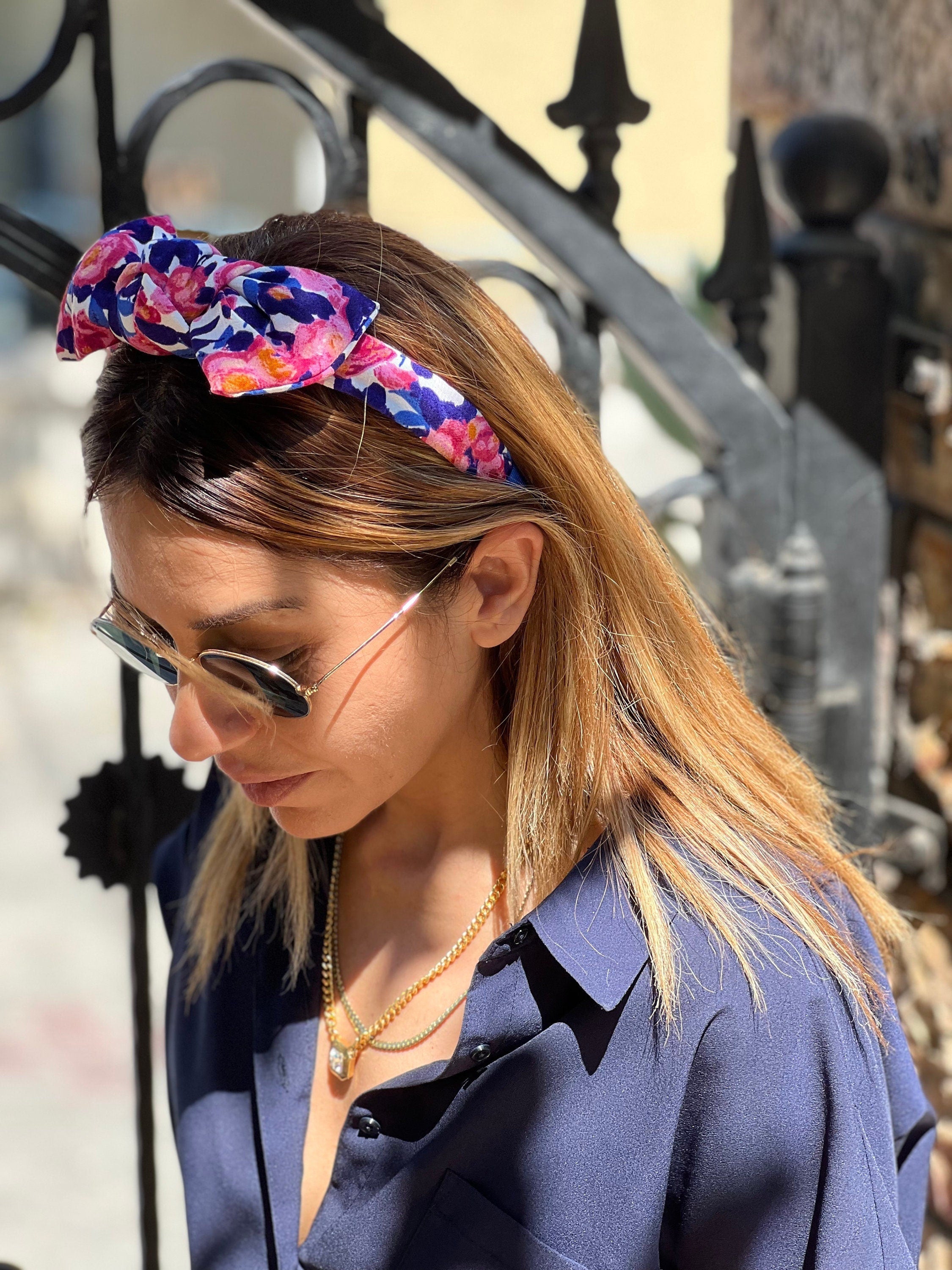 Stay stylish and comfortable with this pink blue white hair tie headband