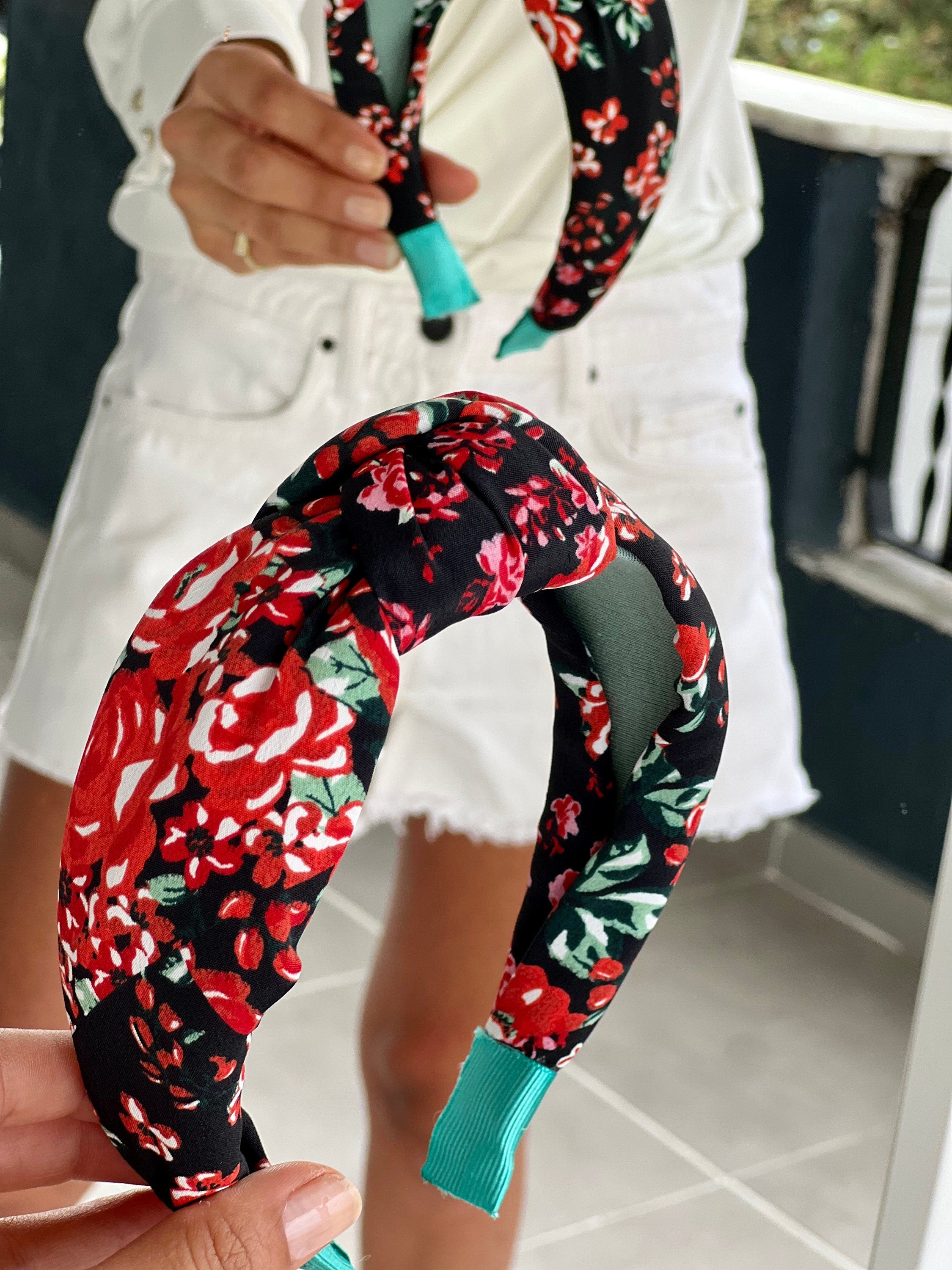 Women's hairband features a bold and vibrant floral pattern for a fun and playful touch.