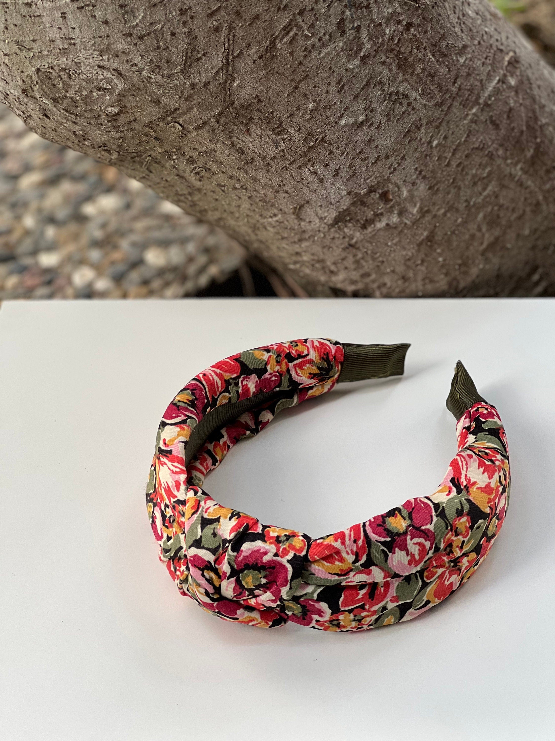 Flower pattern knotted headband: This colorful hair accessory is perfect for adding a pop of color to any outfit.