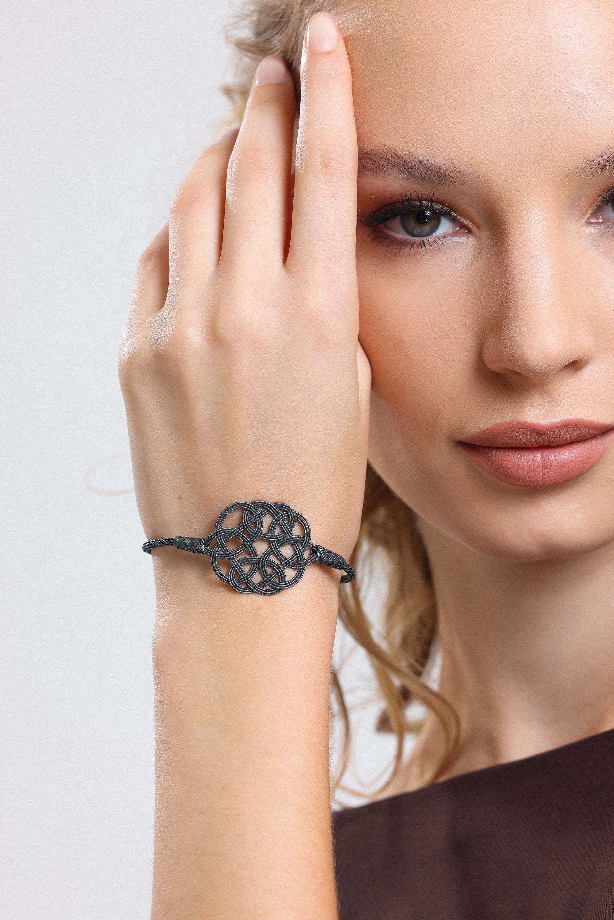 Midnight Mystique: Black Sterling Silver Braided Knot Bracelet