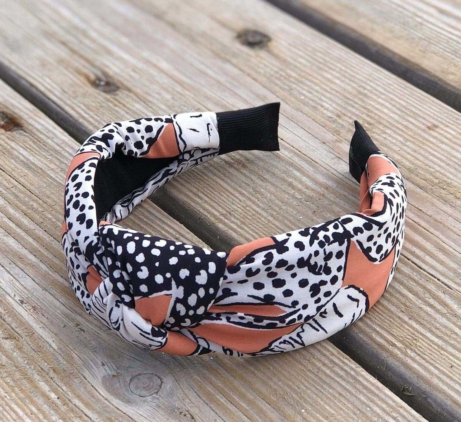 Premium Spotted Pastel Pink Animal Print Headband - Fashionable Pinkish Orange Turban Hairband with Black and White Accents available at Moyoni Design