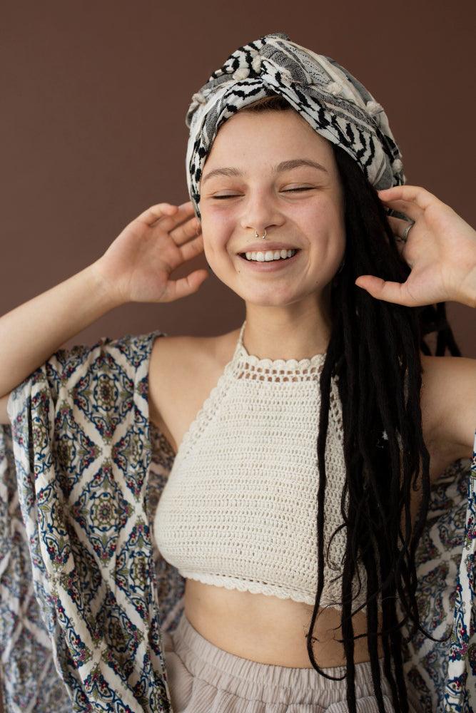 Various hair accessories including headbands, hair clips, scrunchies, and hair ties displayed on a stylish background.