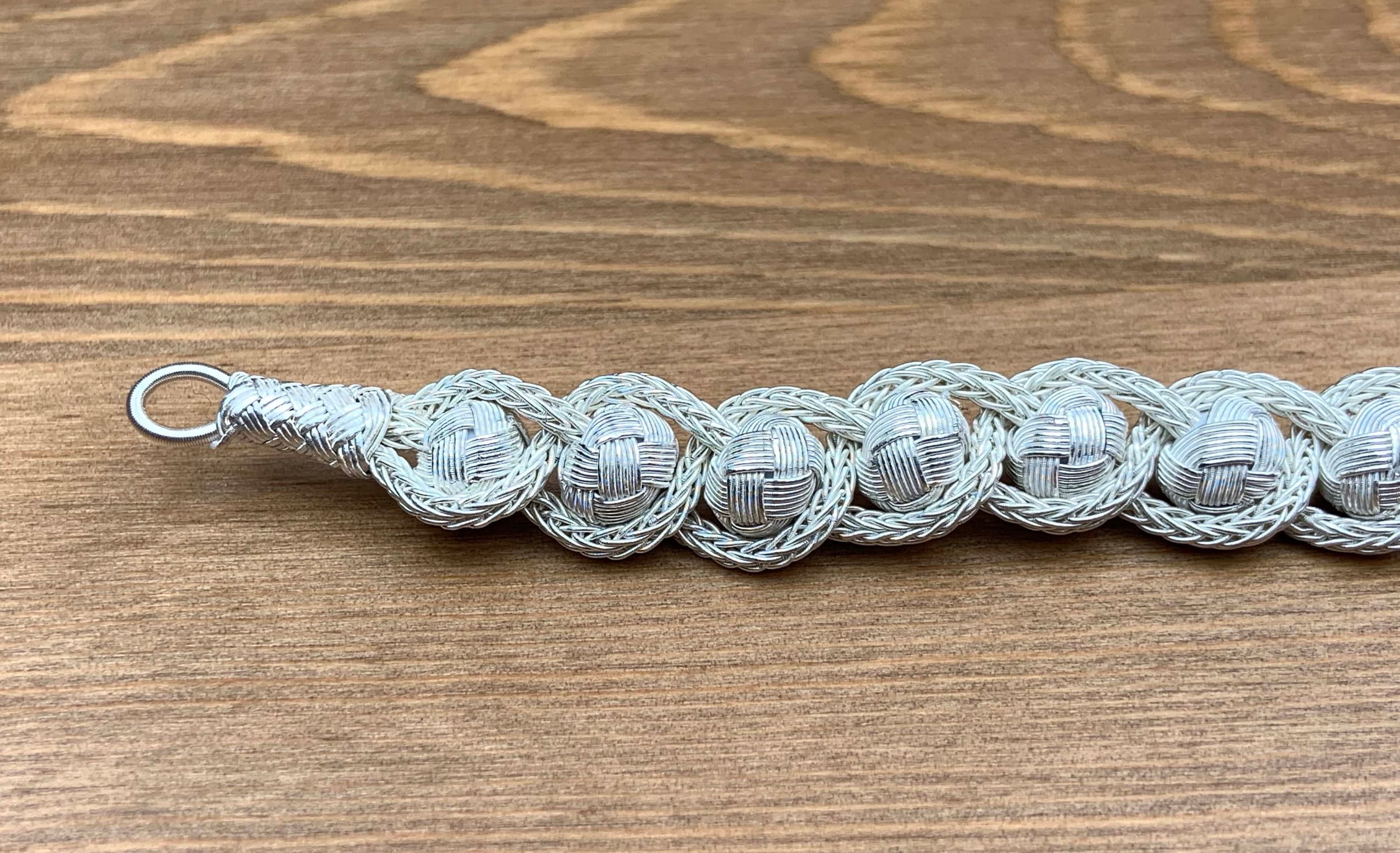 This sterling charm braid knit wire jewelry is a must-have in your jewelry collection. It features a braided jasmine cord and is perfect for anniversary gifts, baby shower gifts, or simply to add a touch of elegance to your everyday style.