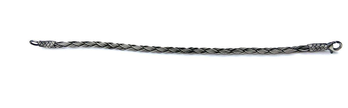 Dazzle your friends and family with a delicate, layered Men's Bracelet made from sterling silver beads and delicate Macrame strands. This classy gift is perfect for anyone on your list!
