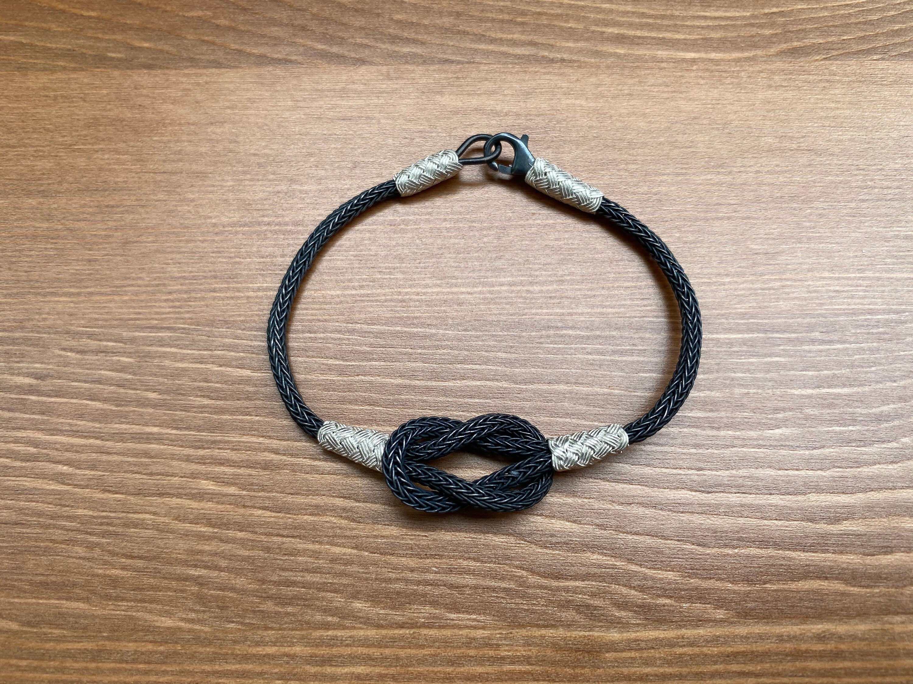 Sleek Black Braided Bracelet with Sterling Silver Accents - Handcrafted Knot Design