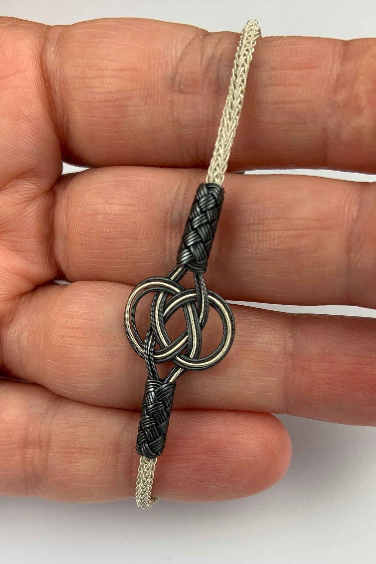 Sterling Silver and Black Braided Bracelet - Elegant Knot Design