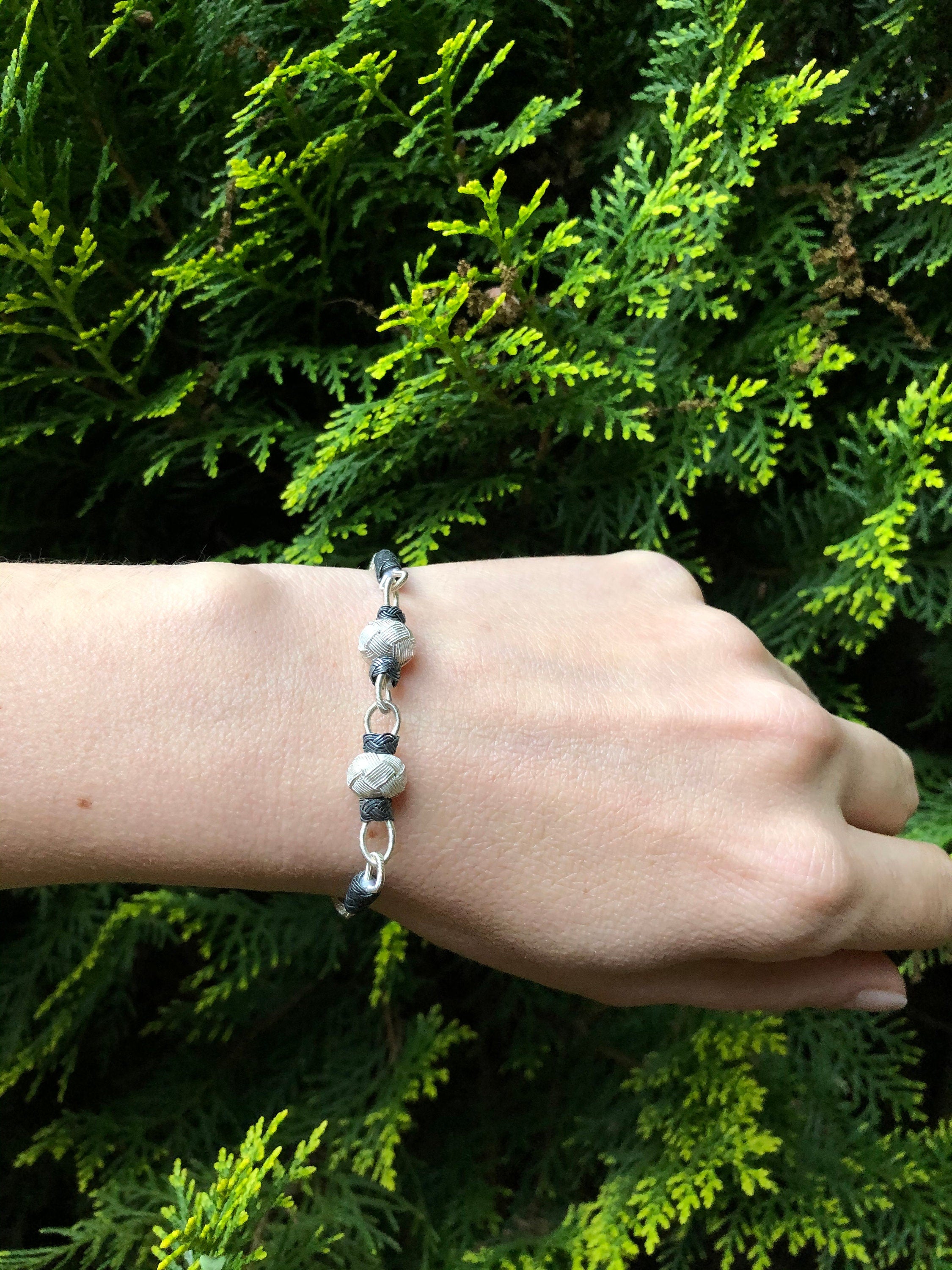 Looking for the perfect girl friend gift? Look no further than our Two Toned Bracelet! This bracelet is made from sterling silver and features a toned link bracelet and sterling charm braid.