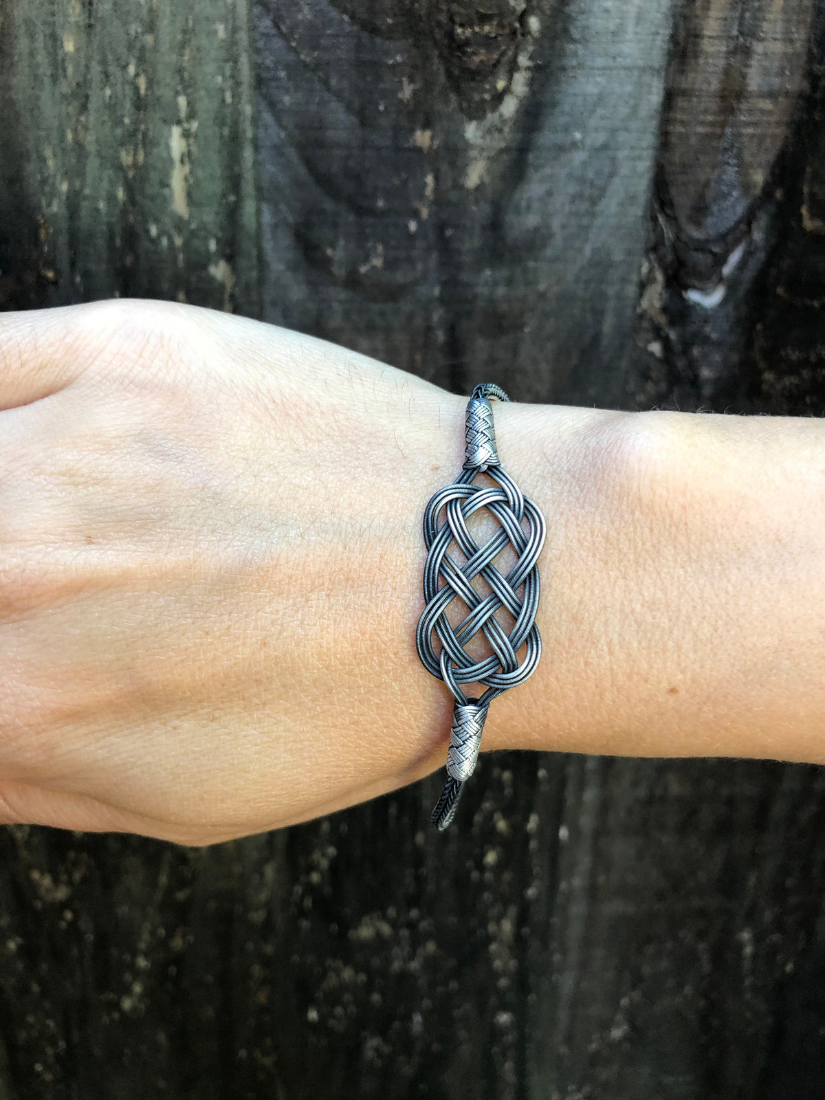 Give your loved one a sterling silver bracelet that is both unique and stylish. Made with beautiful braided wire, this bracelet is sure to impress.