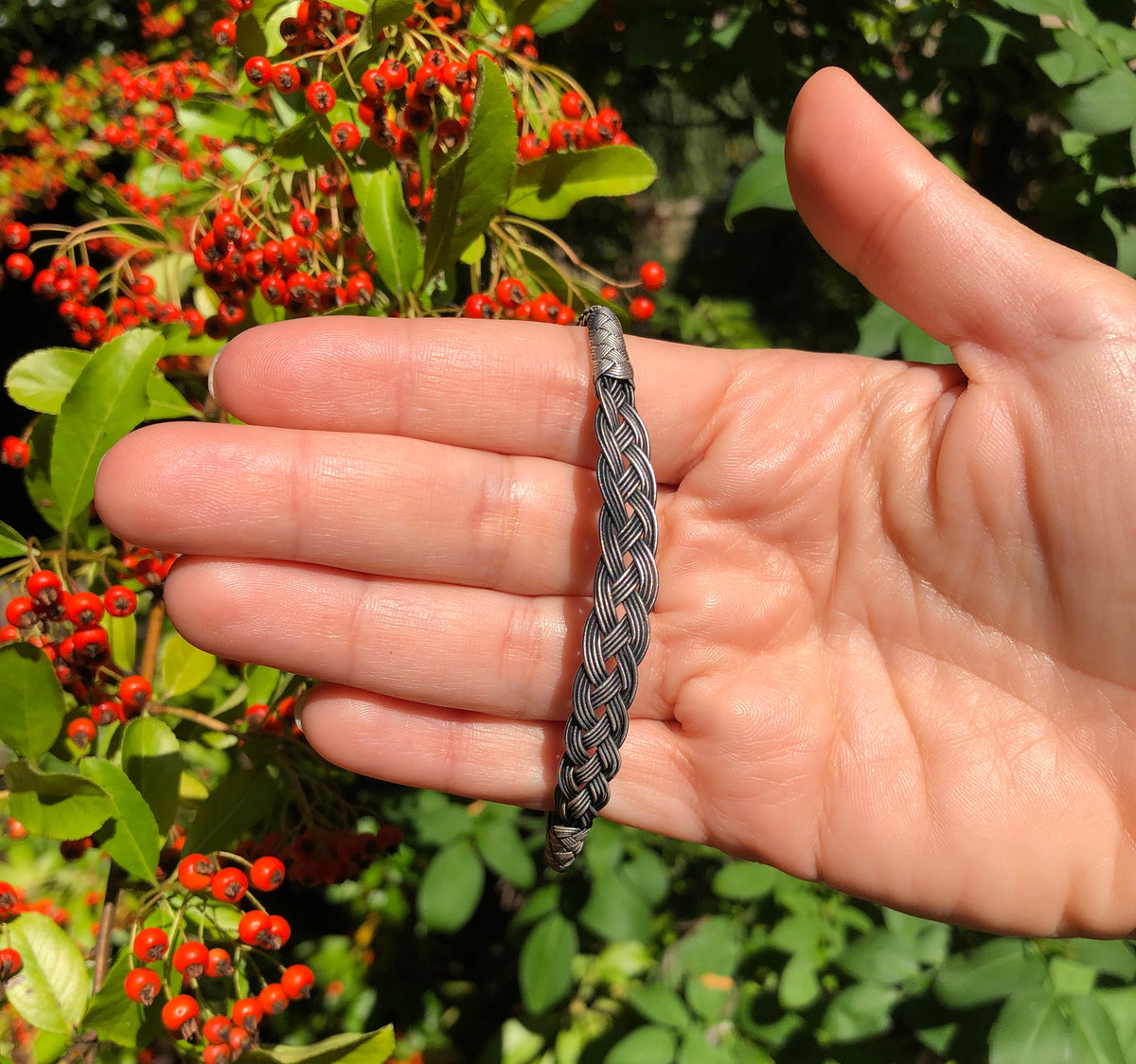 Make mom's day with this beautiful, handmade silver bracelet! It is made of multiple layers of sterling silver, and it comes with a delicate, sterling silver chain.