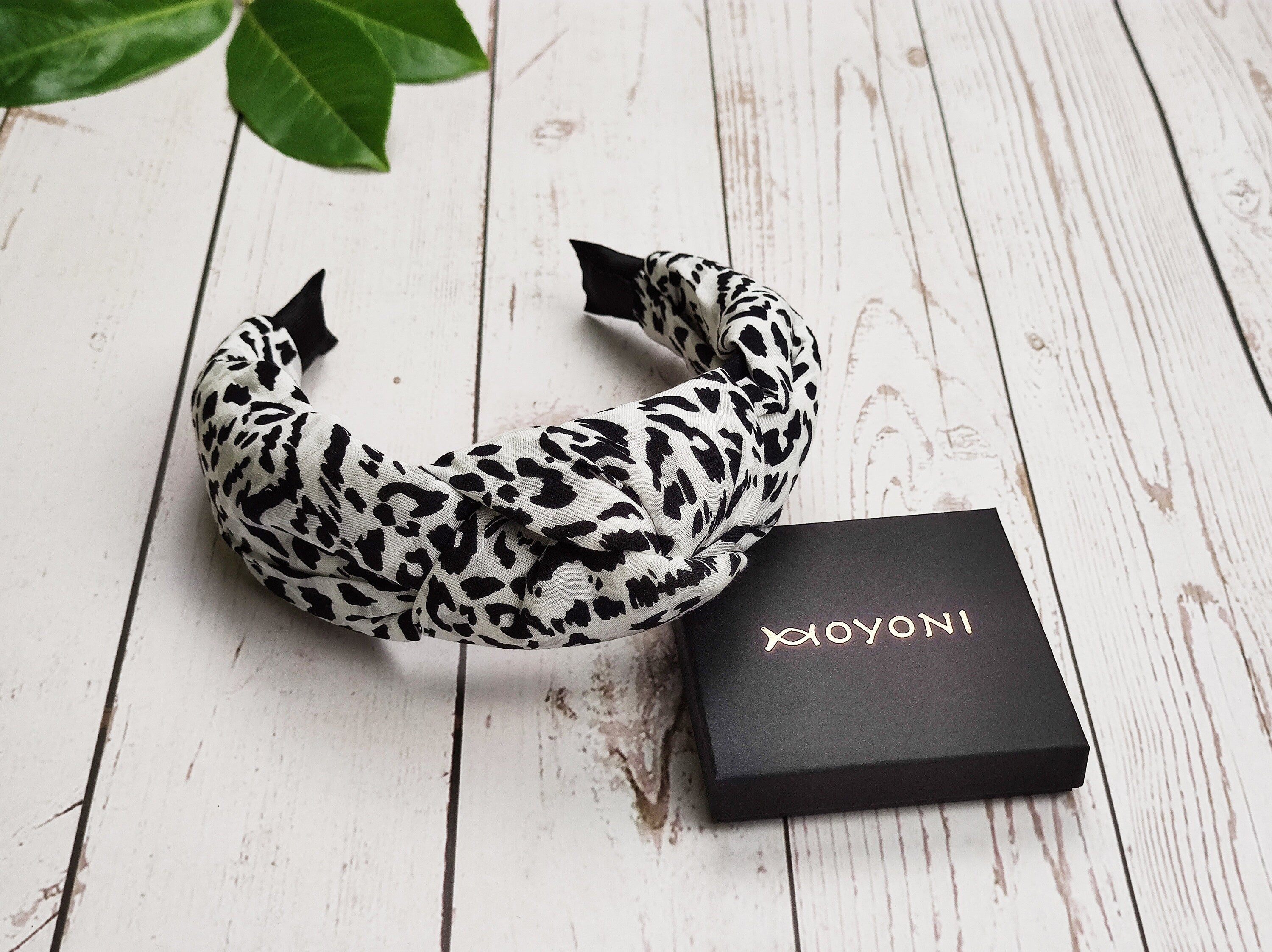 Elevate her hair game with this fashionable leopard print knotted headband, perfect for any occasion.