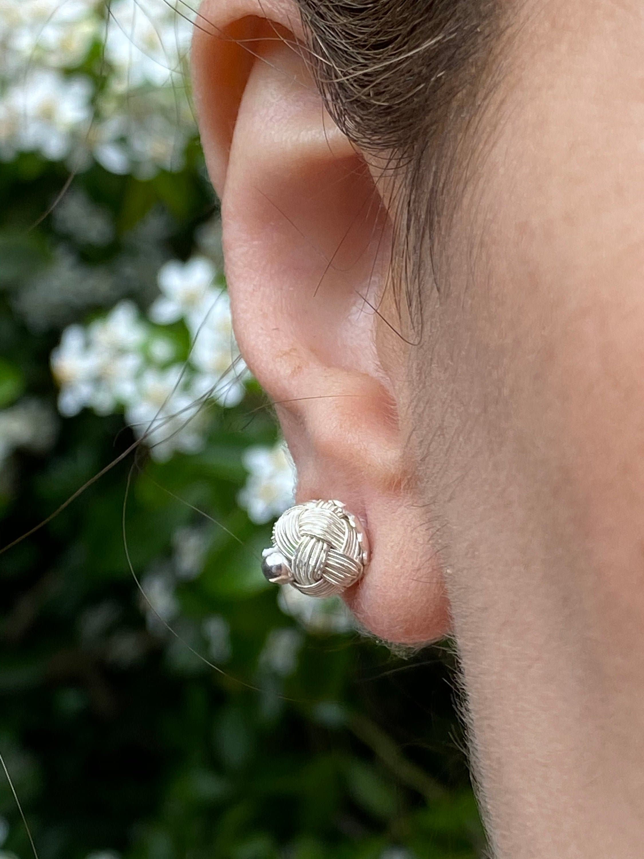 Add a touch of boho-chic to your look with these handmade earrings made with sterling charm braid. They are perfect for dressing up or down and are made with high-quality silver wire.