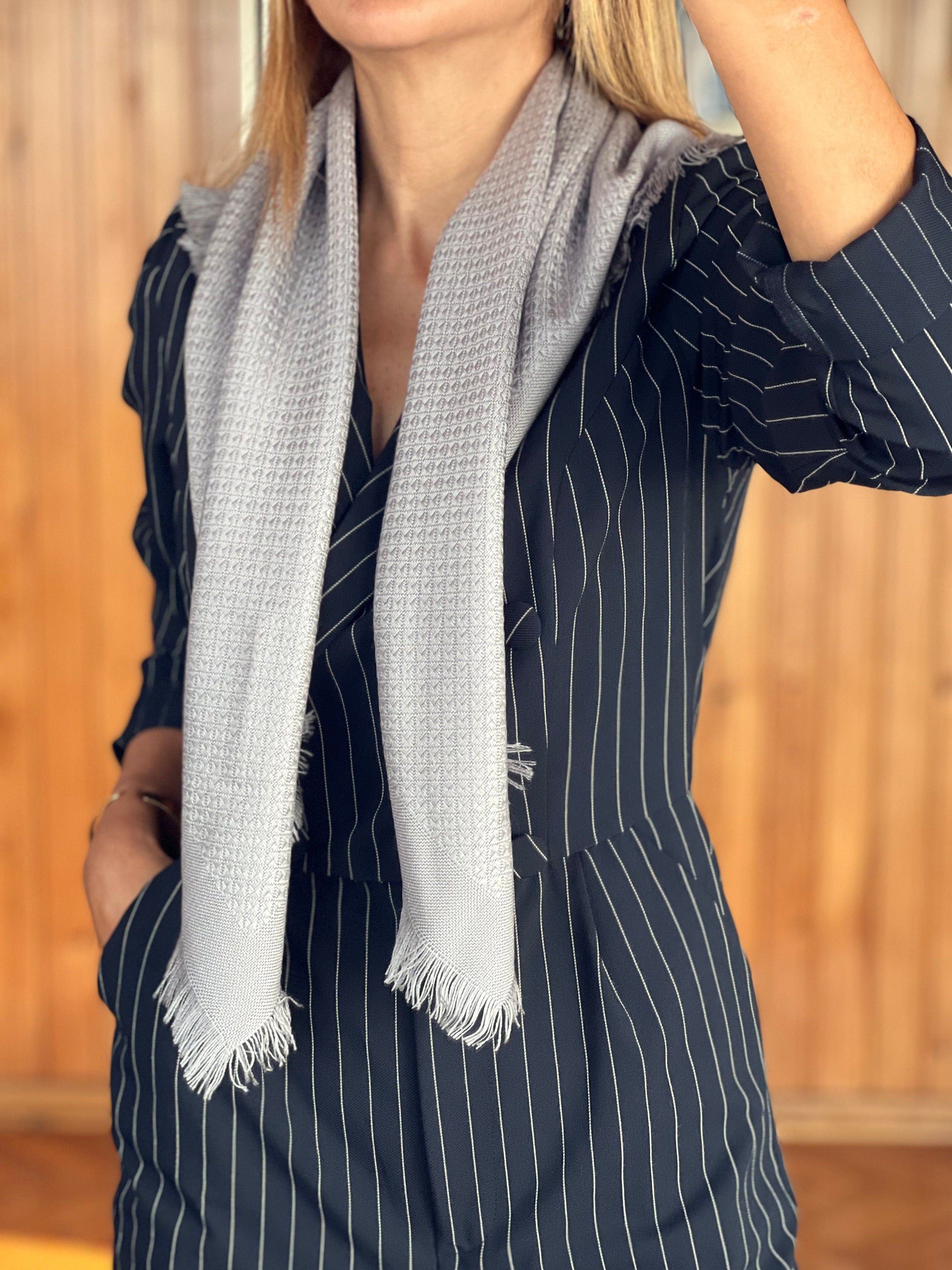 Make a statement with this chic and versatile light grey square solid scarf.