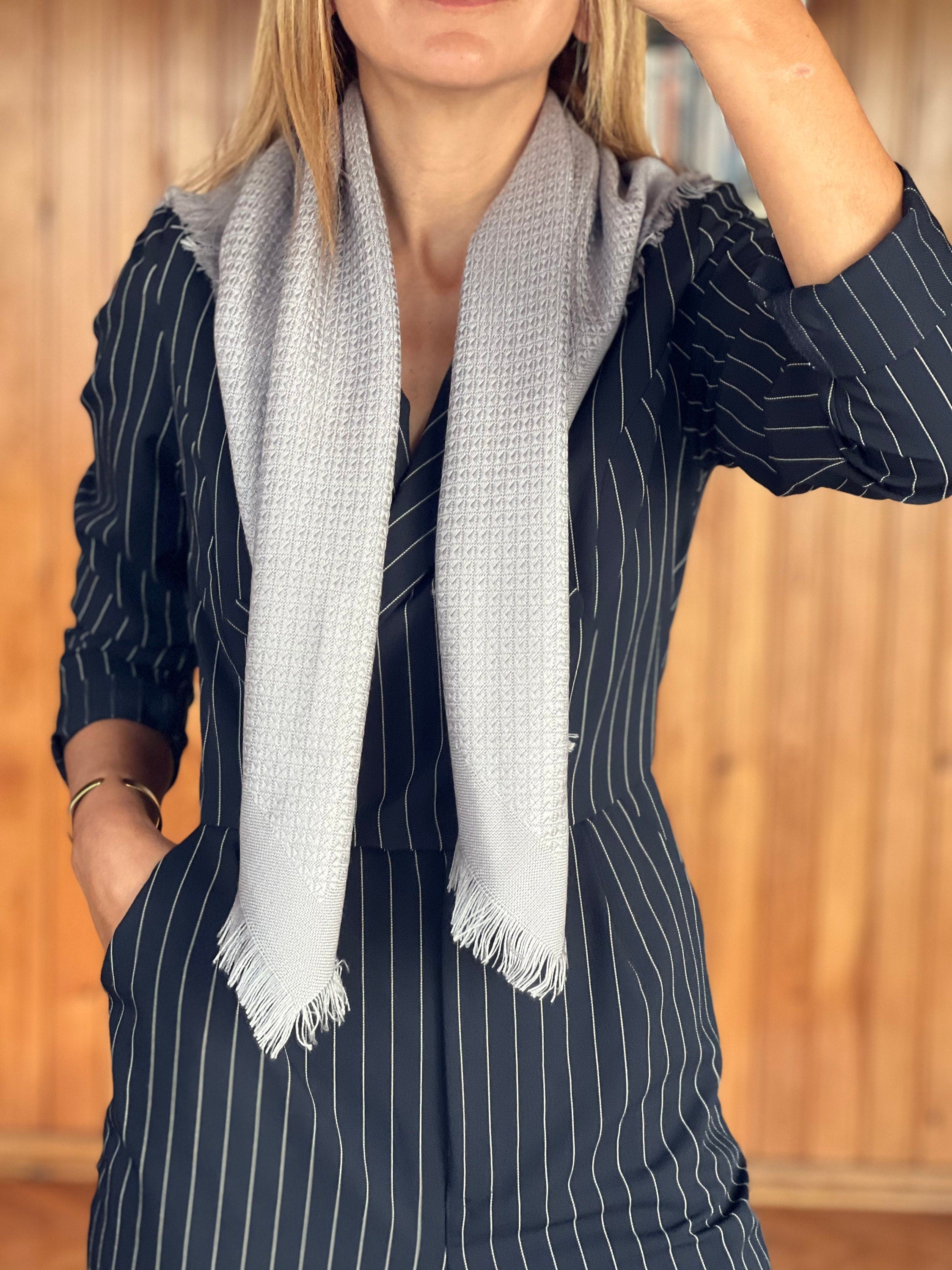 Stay cozy and on-trend with this light grey cotton scarf, the ultimate gift for any woman.