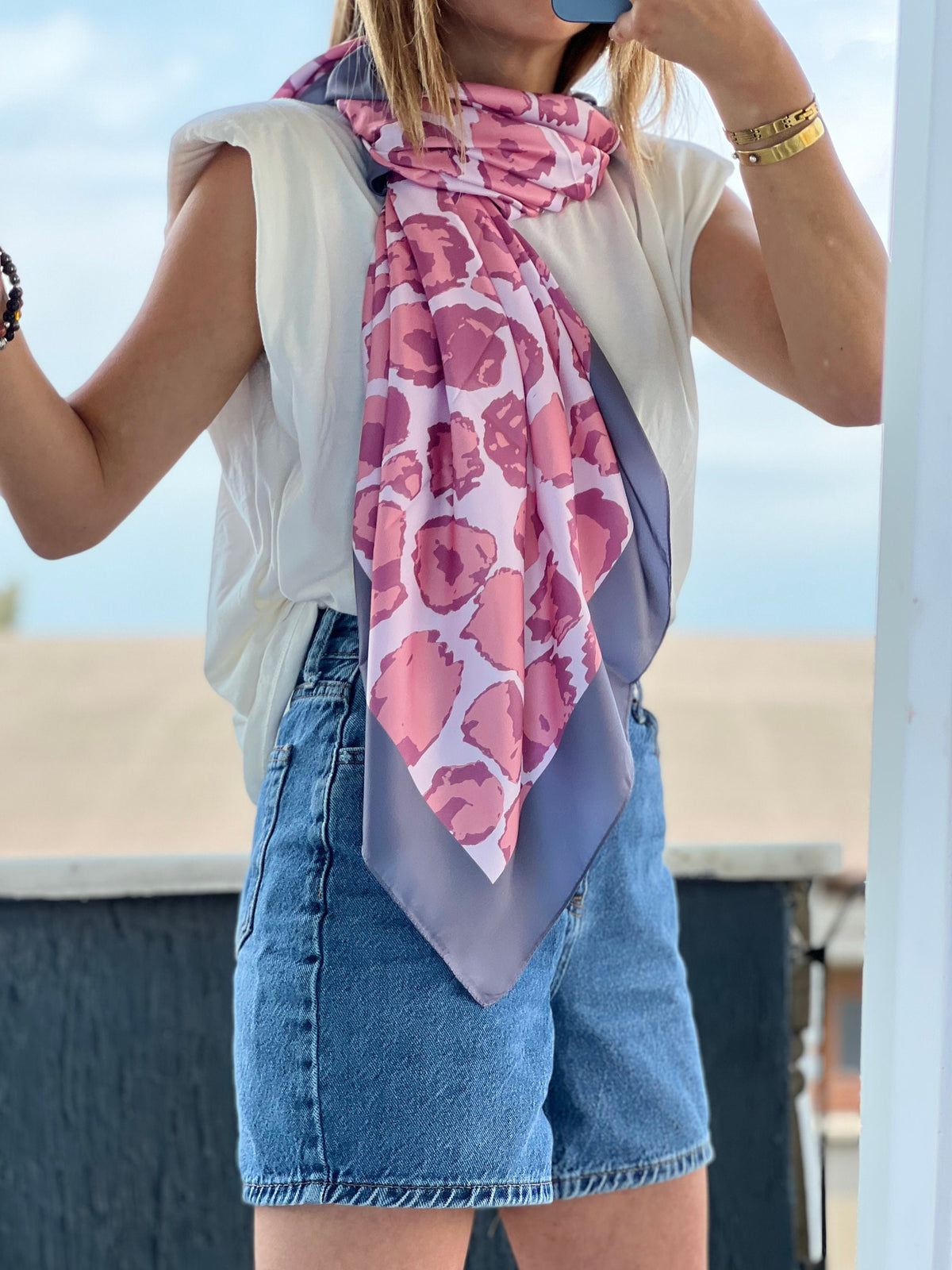 Pink lilac leopard pattern scarf that adds a pop of color to any outfit.
