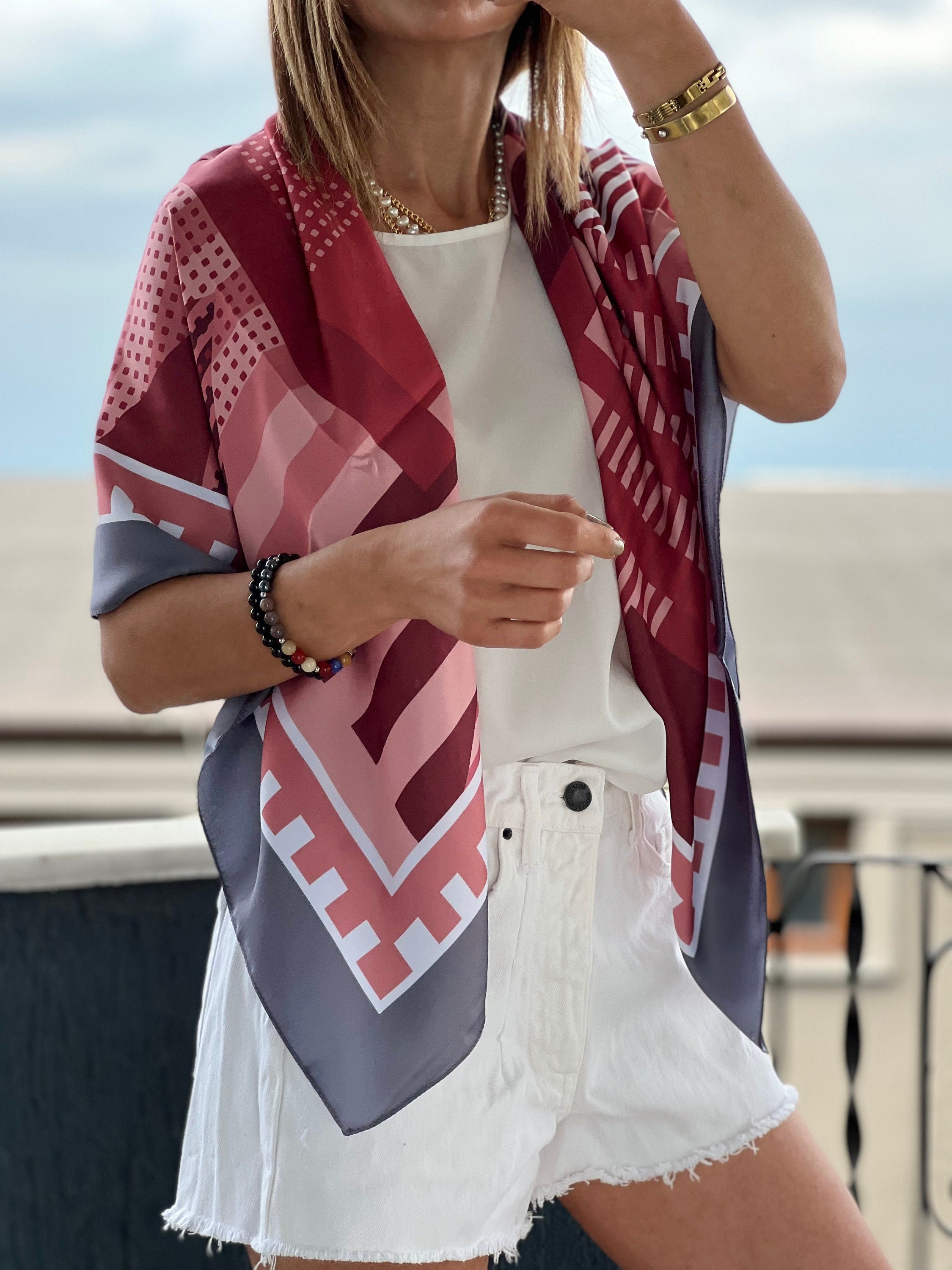 Silk Satin Blend Scarf in a classic black and white polka dot pattern, perfect for adding a touch of vintage charm to your look.