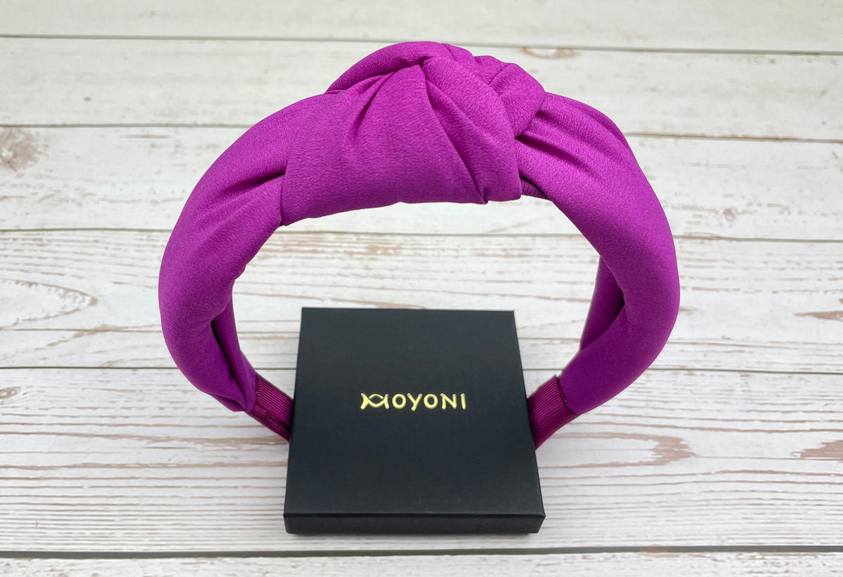 Make a statement with this Headband for Girls, featuring a bold cyclamen pink color and padded design