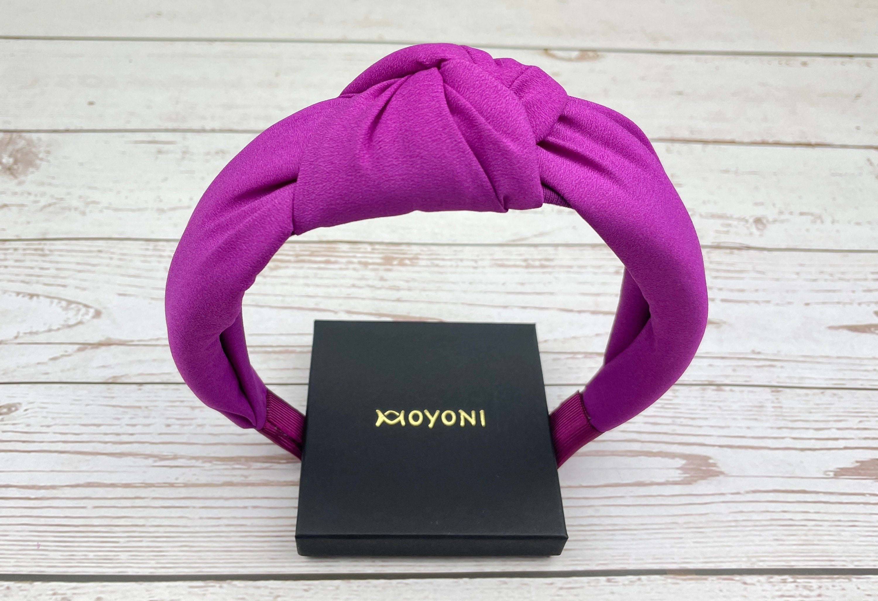 Make a statement with this Headband for Girls, featuring a bold cyclamen pink color and padded design