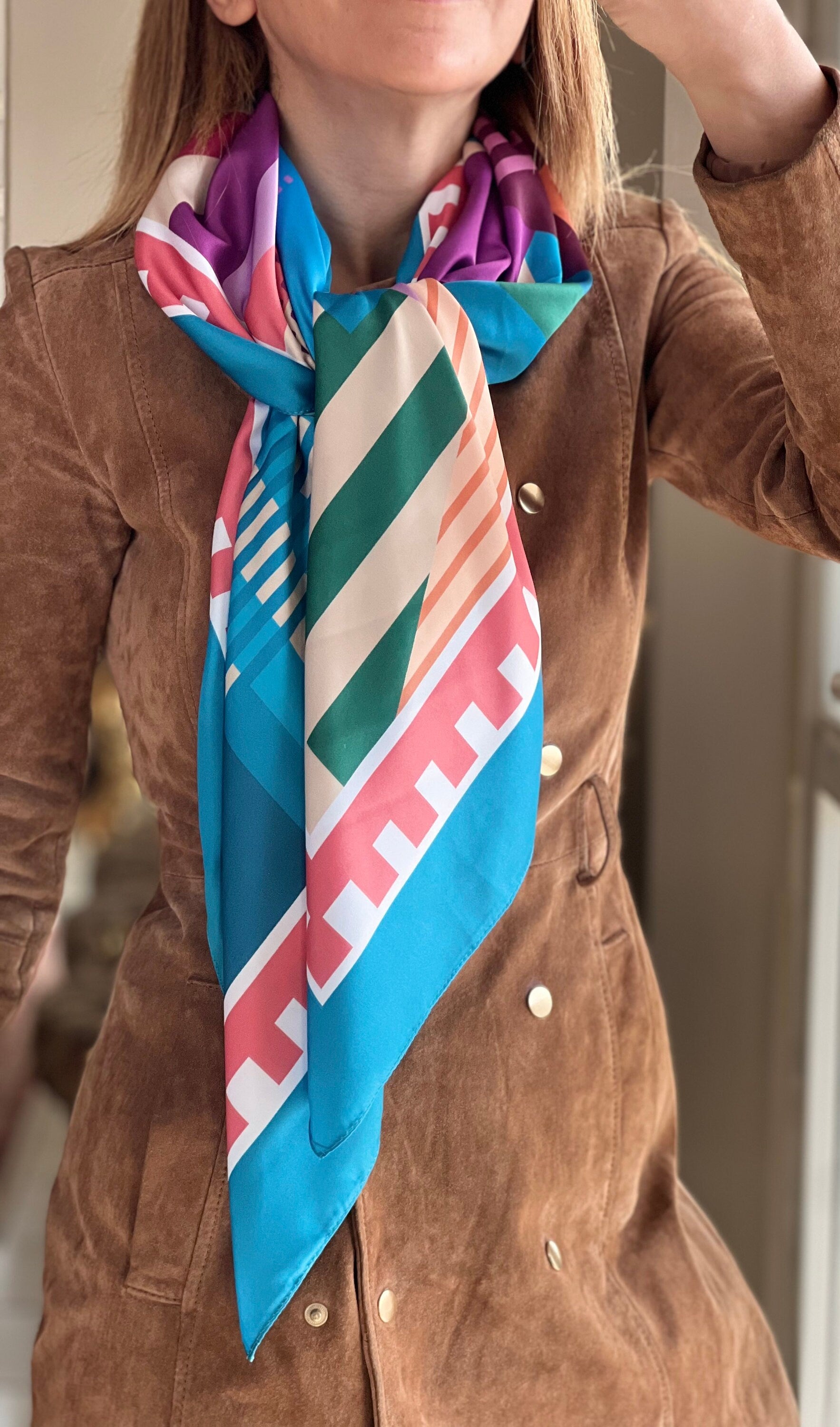 Looking for the perfect accessory to complete your outfit? Our designer scarves are the answer! With their stunning colors and unique geometric patterns, these scarves are sure to make a statement and elevate your style.