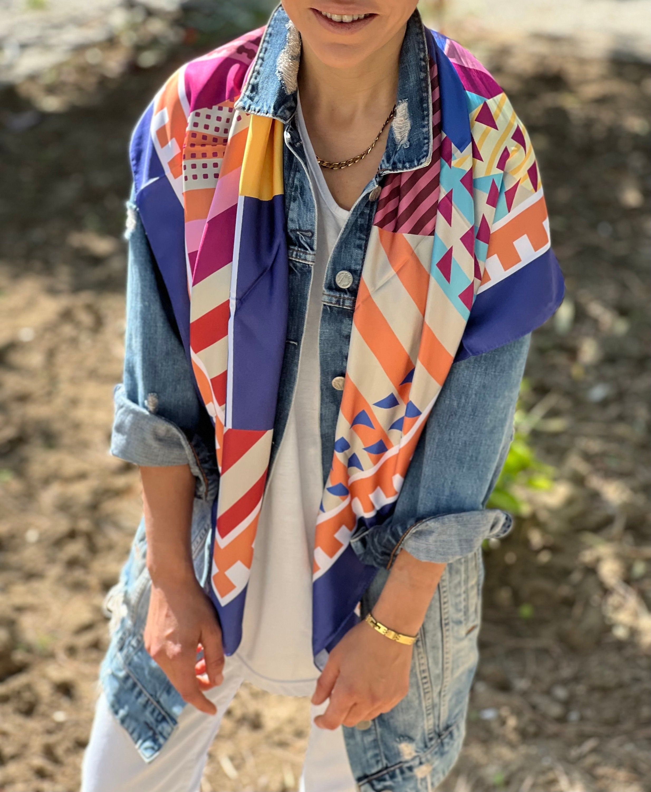 Stay cool and stylish all summer long with this bright and colorful satin scarf.