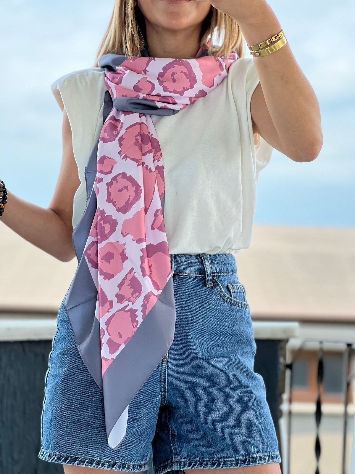 Large square scarf that can be worn in multiple ways, perfect for any occasion.