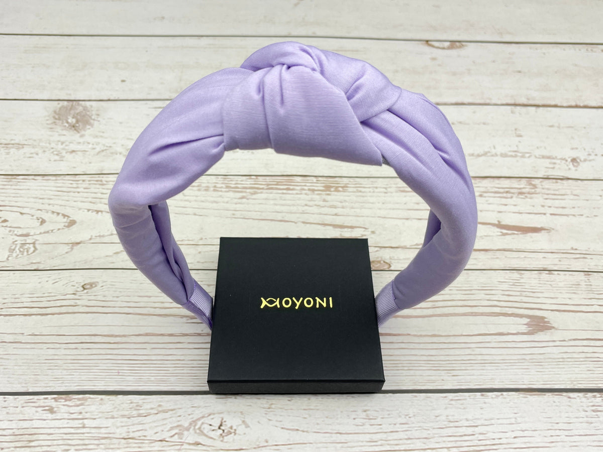 Add a pop of color to your look with this beautiful lavender wide headband.