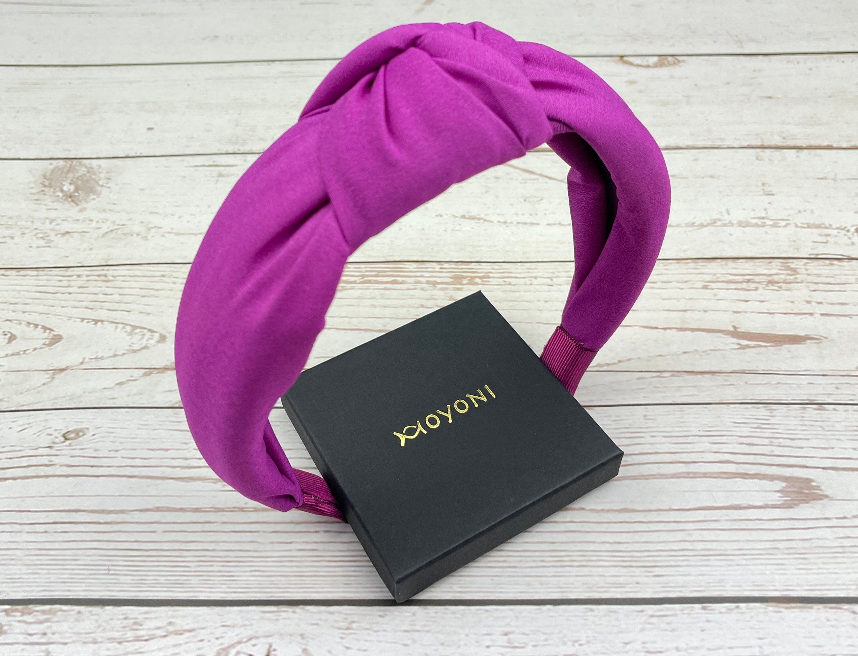 Experience effortless elegance with this Dark Pink Turban Hairband, perfect for adding a touch of sophistication to your everyday look.