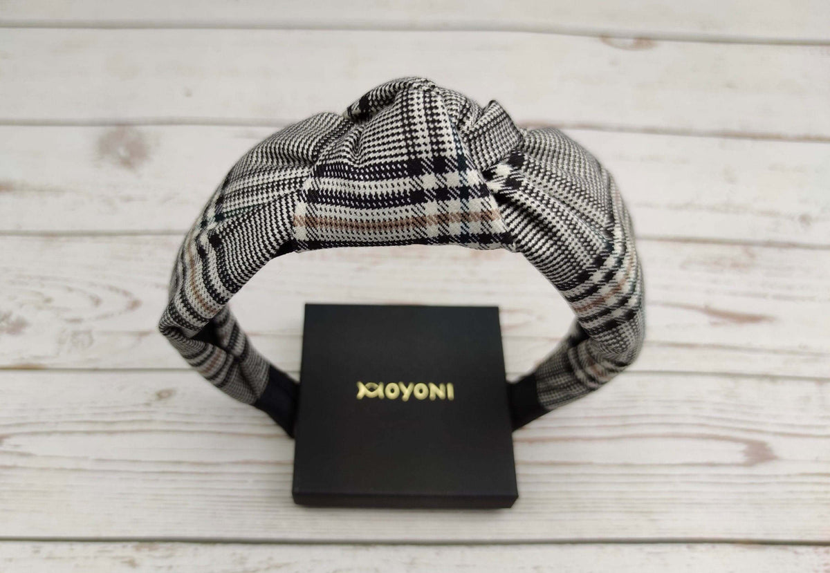 Stylish Striped Knotted Headband: Elevate your college girl look with this chic crepe headband in white and black stripes. Versatile and trendy for any occasion.