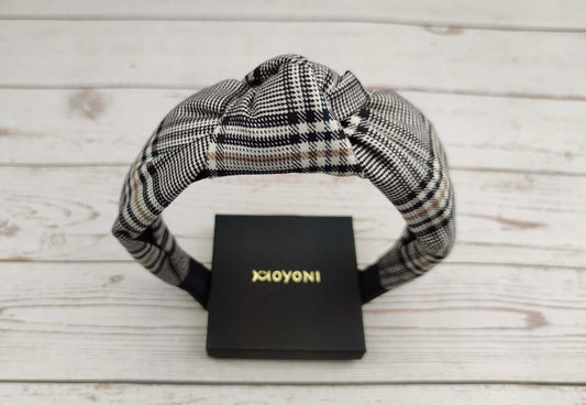 Stylish Striped Knotted Headband: Elevate your college girl look with this chic crepe headband in white and black stripes. Versatile and trendy for any occasion.