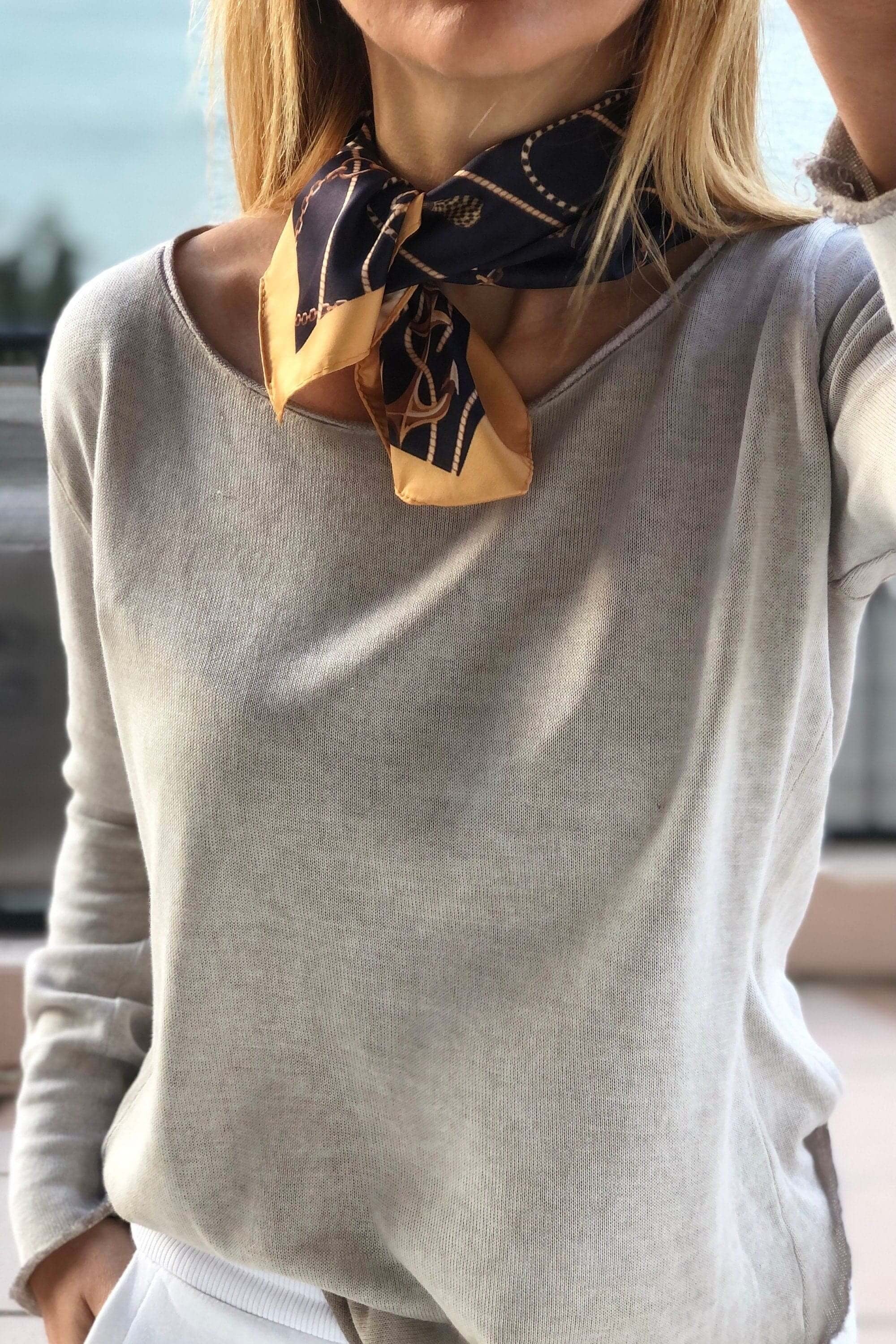 Indulge in some luxuriousness this Summer with a neck scarf! Stay cool and stylish while keeping your neck warm with this elegant piece of clothing.