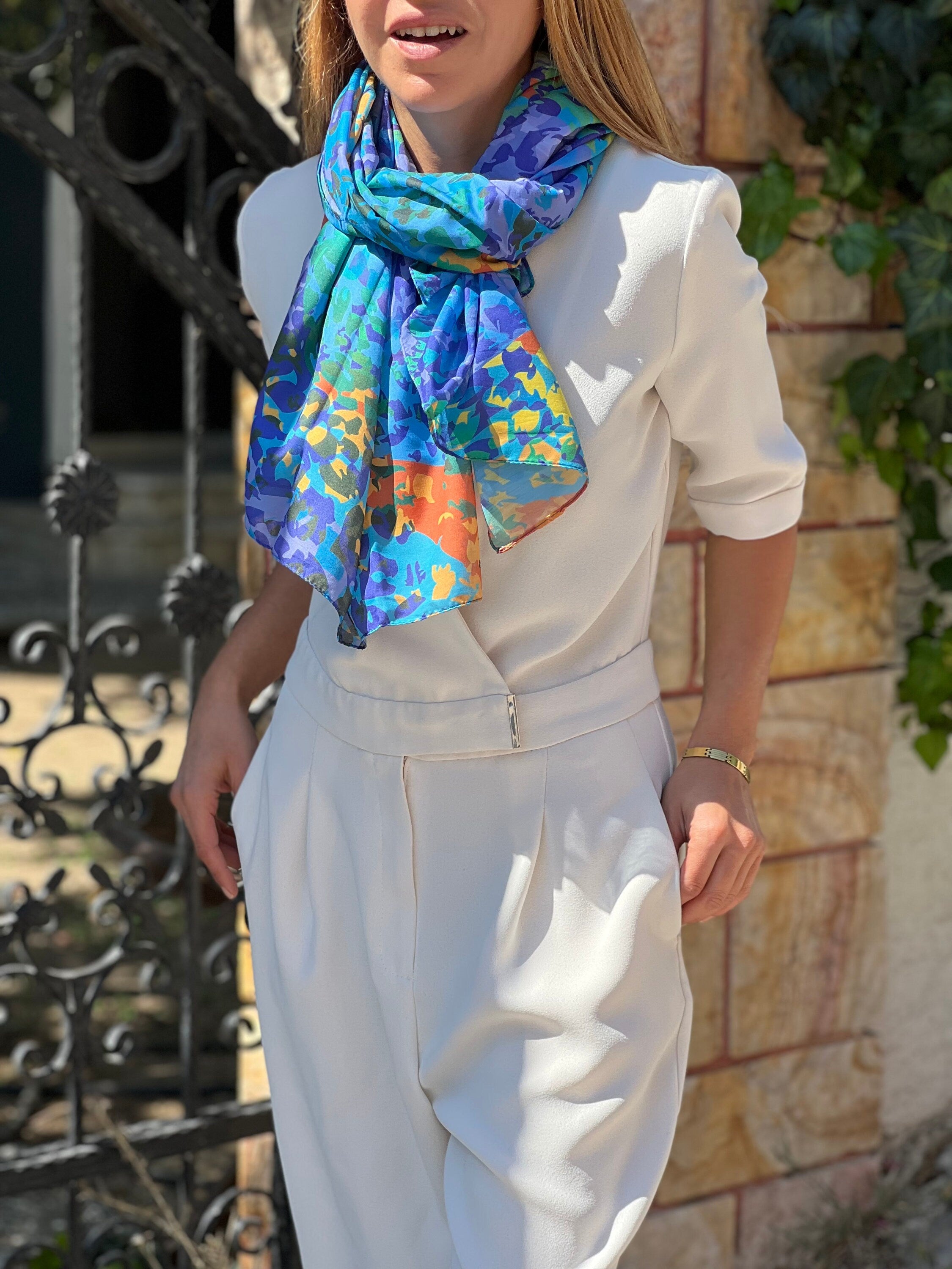 Transform your look with this stylish Cotton Viscose blend voile rectangle scarf. Suitable for spring and autumn, this lightweight scarf features a delicate and airy fabric that adds a touch of sophistication to any outfit.