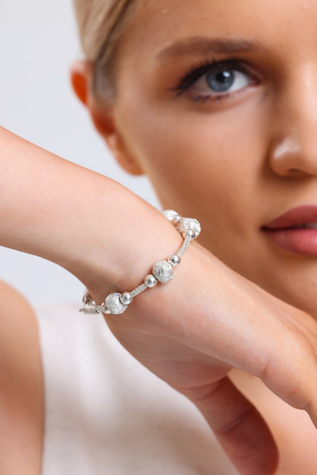 Elegant Silver Braided Knot Bead Bracelet