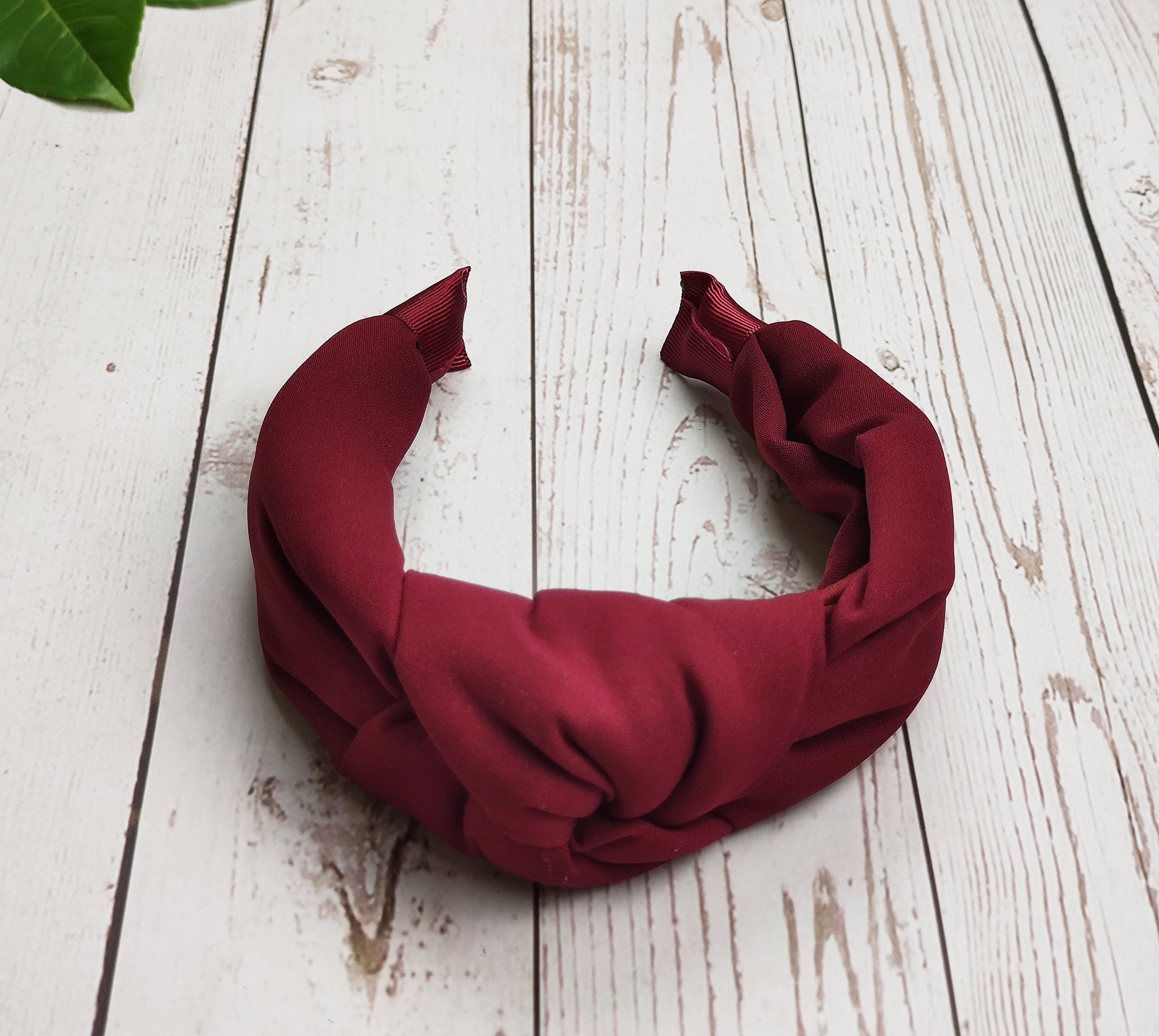 Get that glamorous look you crave with this fashionable handcrafted knit headband in wine color. Crafted from high-quality materials, this headband is perfect for every outfit, day or night.
