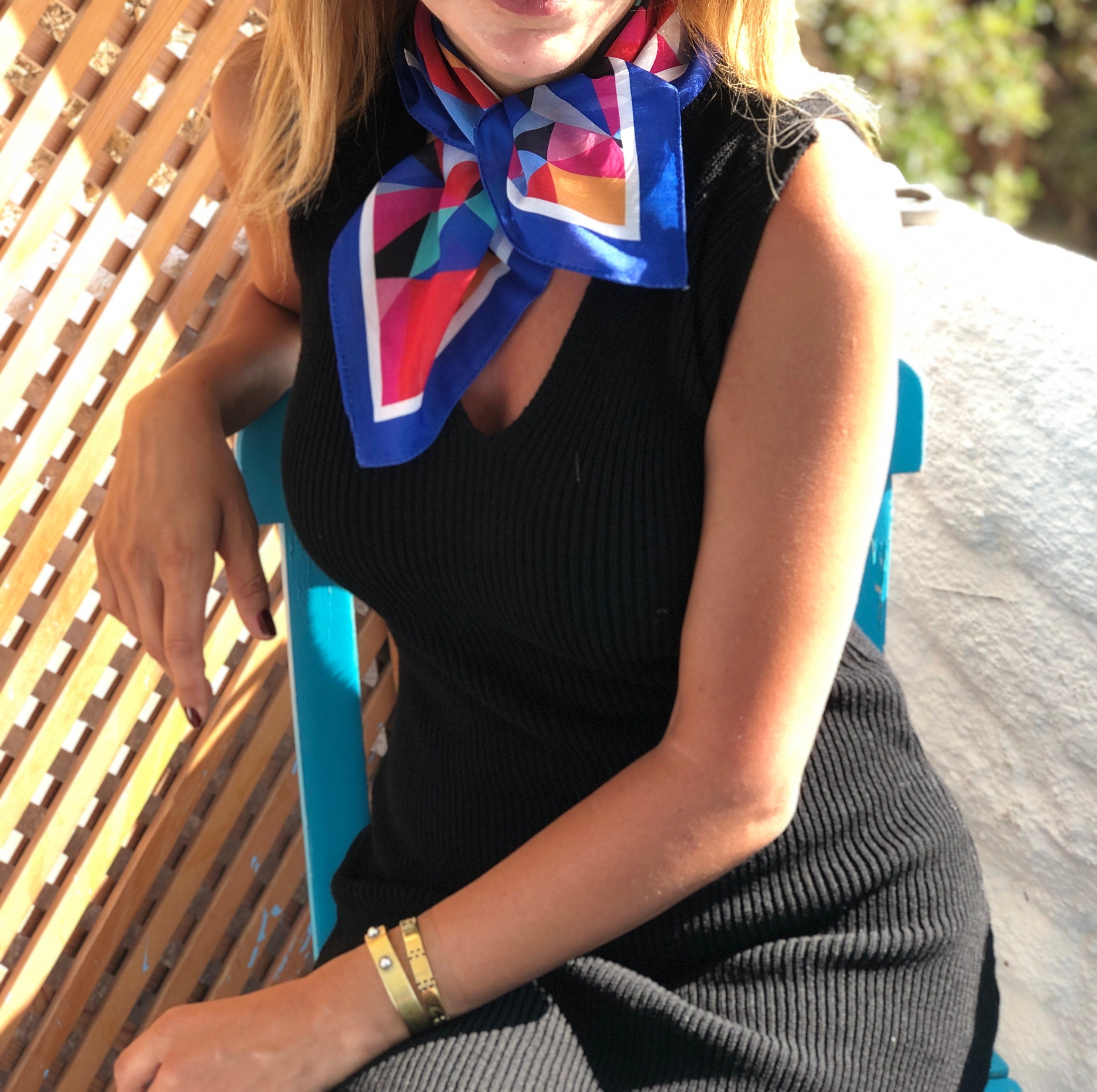 Make a statement with this bright color head scarf, a unique and trendy accessory.