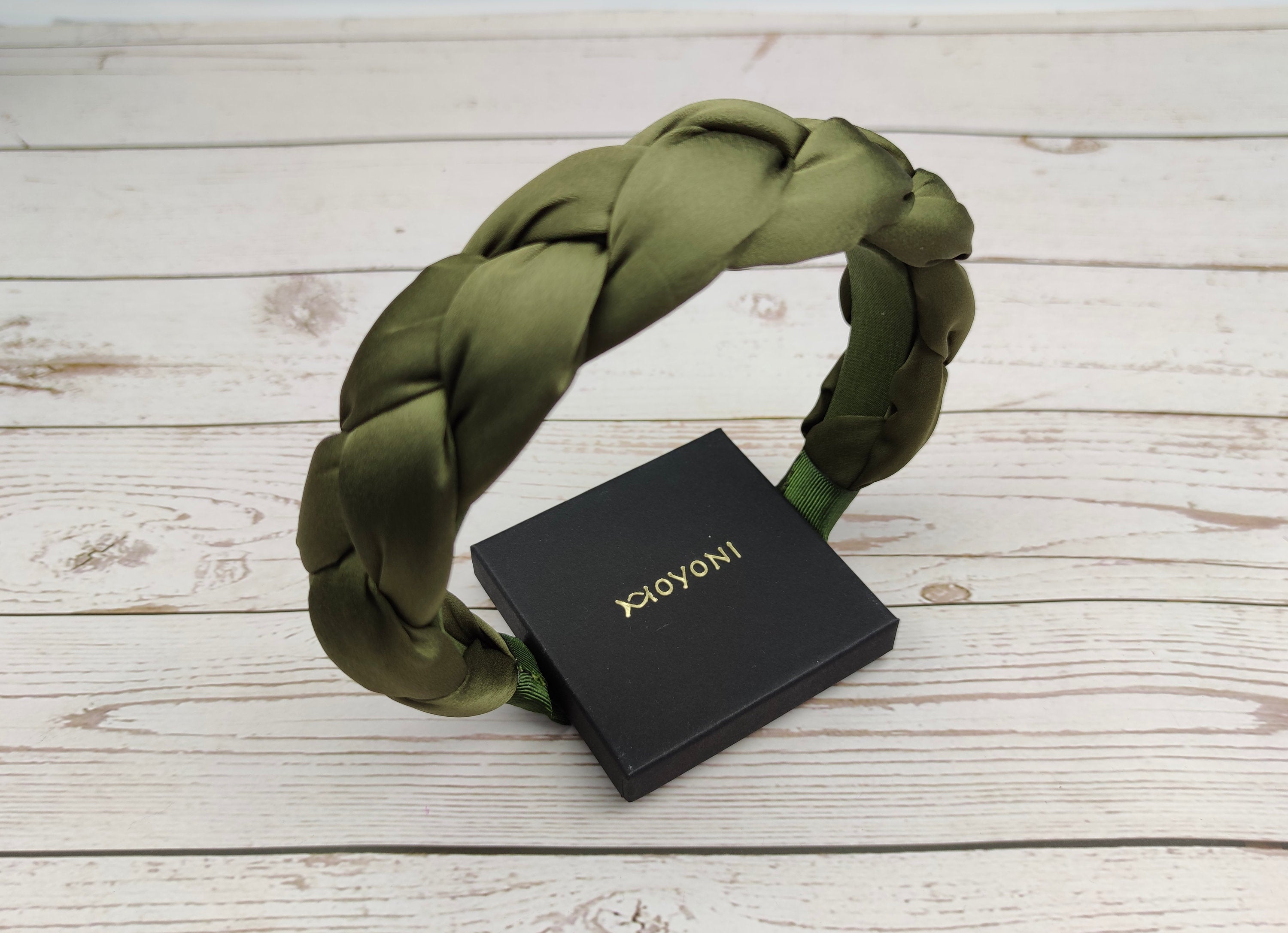 The perfect accessory for any hairstyle: a chic braided padded satin headband in army green.