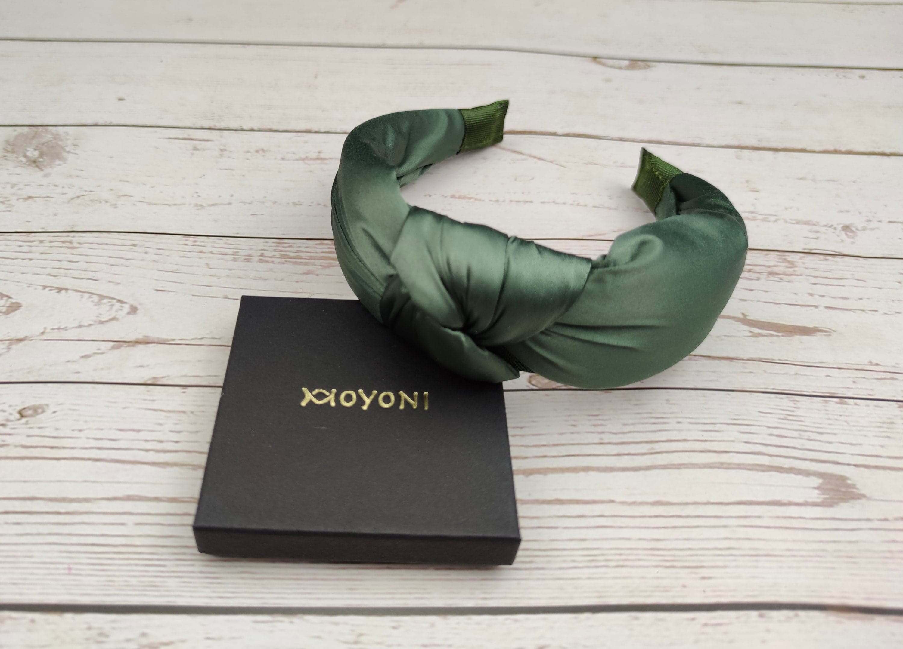 Get into the Christmas spirit with this festive Olive Green color padded satin headband! This headband is made of soft and comfortable satin fabric and will keep your hair looking beautiful all season long.